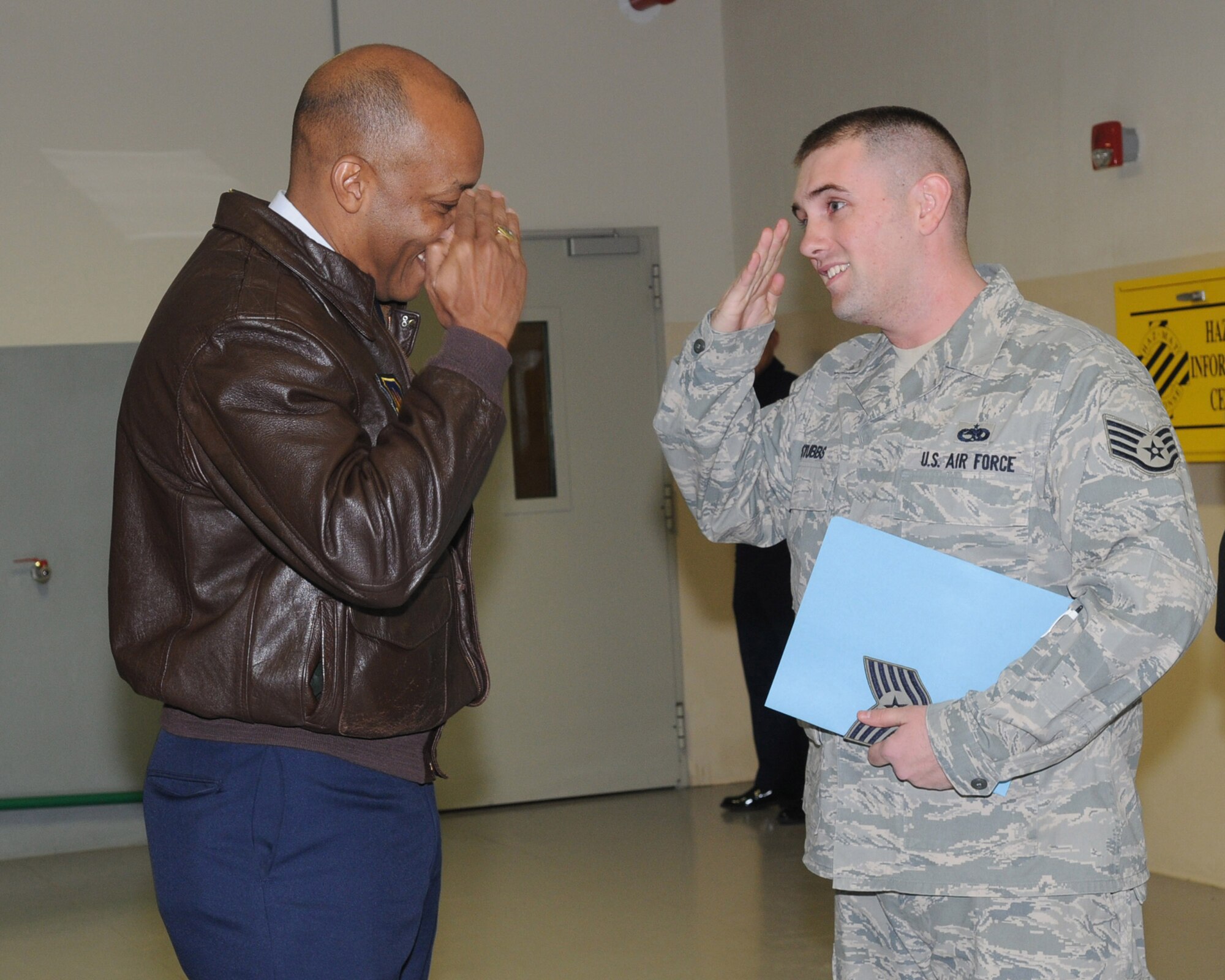 Tech. Sgt.  Adam Stubbs, 31st Munitions Squadron, renders his first salute as a Technical Sergeant to Brig. Gen. C.Q. Brown Jr., 31st Fighter Wing commander, during his STEP promotion. Tech. Sgt. Stubbs was awarded the new stripe through the Stripes for Exceptional Performers program. (U.S. Air Force photo/ Staff Sgt. MercedesKimble L. Crossland)  