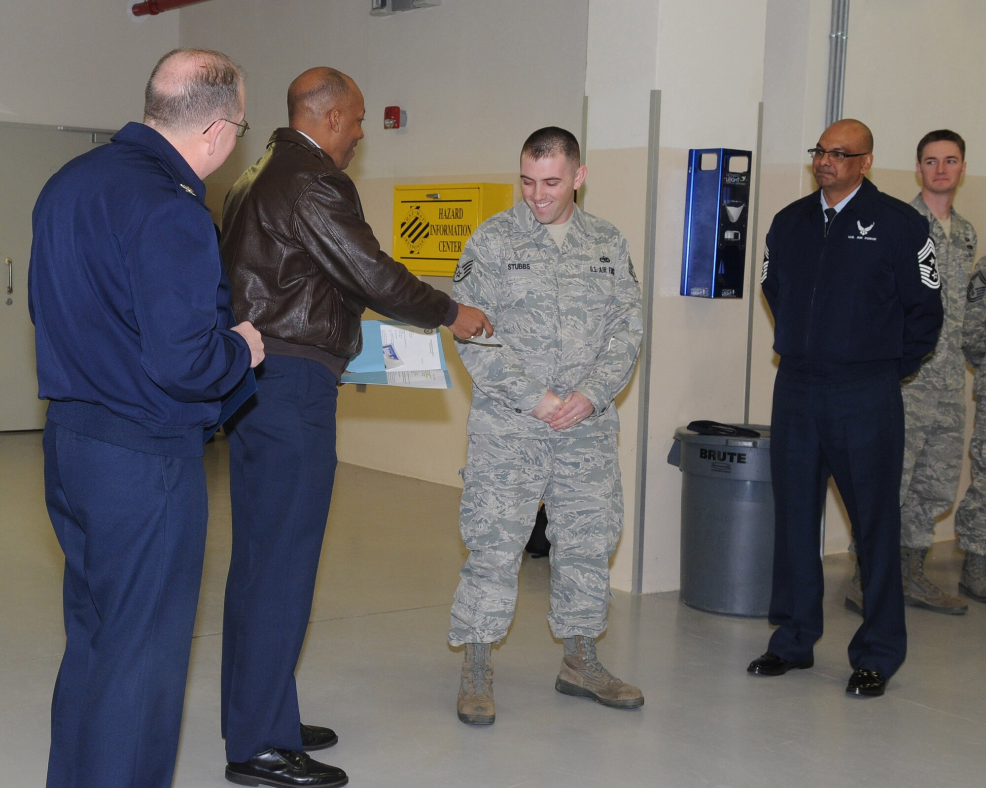 Brig. Gen. C.Q. Brown Jr., 31st Fighter Wing commander, hands Tech. Sgt.  Adam Stubbs, 31st Munitions Squadron, a new set of stripes he earned during his STEP promotion. Tech. Sgt. Stubbs was awarded the new stripe through the Stripes for Exceptional Performers program. (U. S. Air Force photo/Staff Sgt. MercedesKimble L. Crossland)  