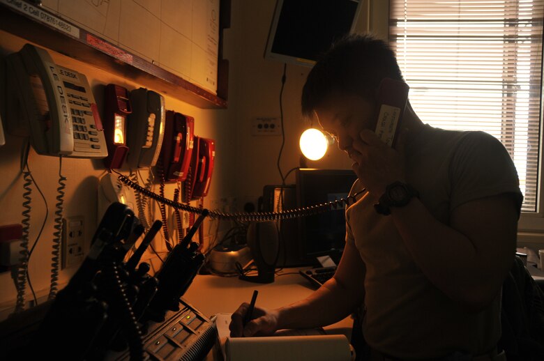 Staff Sgt. Vince Remo, 48th Medical Operations Squadron emergency room technician, answers a crash phone in the emergency room at RAF Lakenheath, England. The crash phone is used to provide the ER with any information regarding emergencies happening on or around base. (U.S. Air Force photo/ Airman 1st Class Eboni Knox)