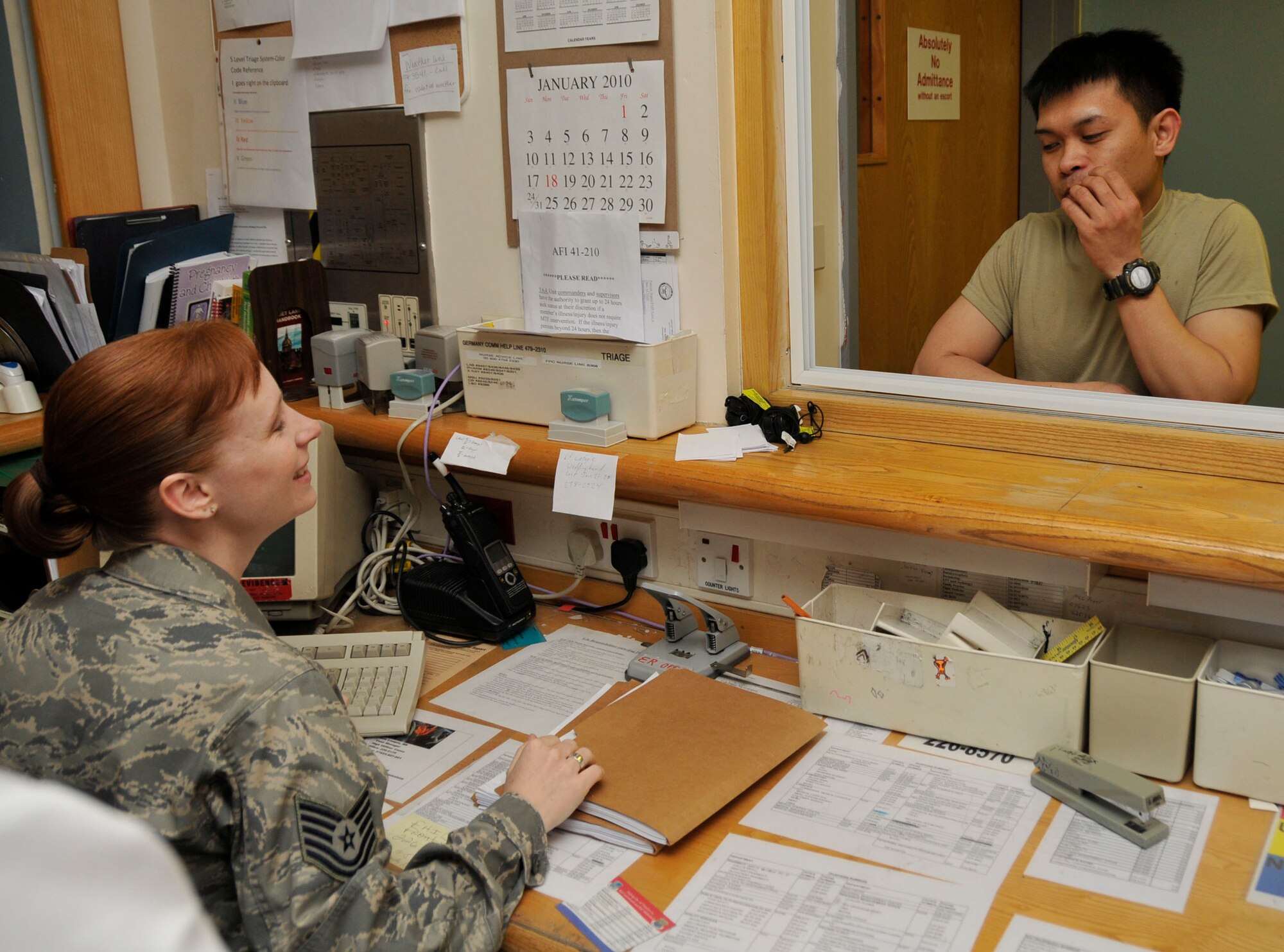 Tech. Sgt. Jaimy Gennero, 48th Medical Operations Squadron emergency room technician, takes a patient’s information in the emergency room at RAF Lakenheath, England. The RAF Lakenheath ER support 12,000 Airmen and their families and those assigned to the surrounding American bases, and checking-in is the first step in servicing a patient. (U.S. Air Force photo/Airman 1st Class Eboni Knox) 