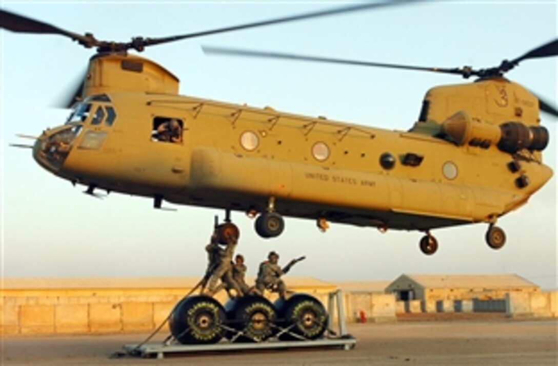 U.S. Army soldiers attach three fuel blivets to a CH-47F Chinook helicopter for transport to Obeidi, an Iraqi outpost near the Syrian border, to establish a temporary Forward Arming and Refueling Point for aircraft operaitons in the area, Feb. 10, 2010. The soldiers are assigned to the 1st Cavalry Division's 1st Air Cavalry Brigade, and the 3rd Infantry Division. 