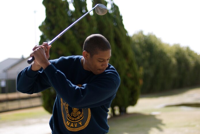 Petty Officer 3rd Class James Hopkins backswings before driving the ball down the fairway at The Longest Yard, the second Commander’s Cup Challenge event, at the Torii Pines Golf Course here Feb. 12. Headquarters and Headquarters Squadron won first place followed by Marine Wing Support Squadron 171 and Marine Aviation Logistics Squadron 12.