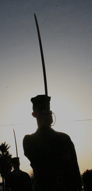 Corporals practice sword manual during the practical application portion of Combat Logistics Battalion 7's Corporals Leadership Course at the Protestant Chapel here Feb. 12. The course included garrison training, such as sword and guidon manual, and also taught the students to be leaders while deployed or in field environments.