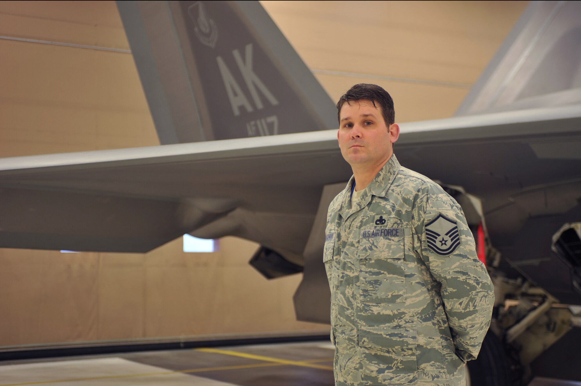ELMENDORF AIR FORCE BASE, Alaska -- Master Sgt. Scott Waugaman, 477th Aircraft Maintenance Squadron, stands in front of an F-22 Raptor Feb. 12. Waugaman was named the Air Force Reserve Command's 2009 Lieutenant General Leo Marquez Award recipient technician supervisor. This award is presented to maintainers who have demonstrated the highest degree of sustained job performance, job knowledge, job efficiency and results in the categories of aircraft, munitions and missile, and communications-electronics maintenance. (Air Force photo by Senior Airman David Carbajal)