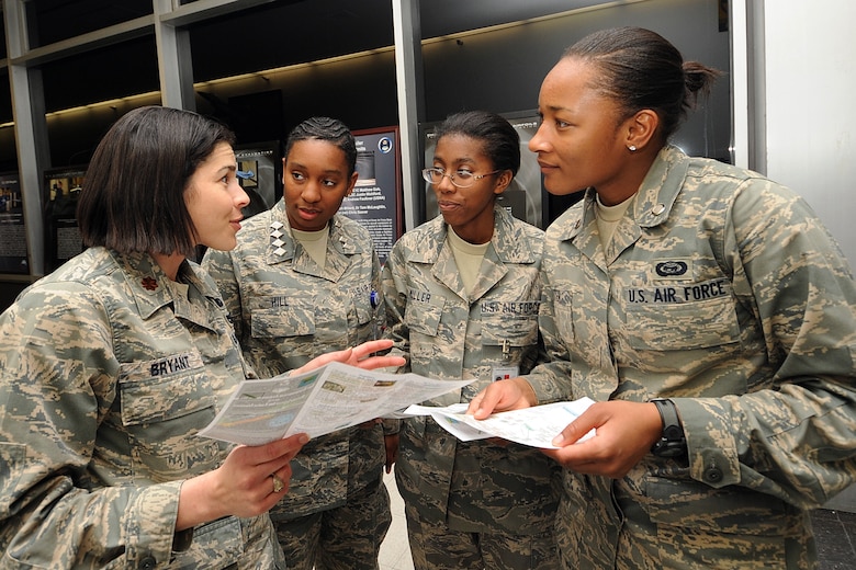 MAj. Elaine Bryant discusses the aeronautics major program with Cadet Candidates Jazmind Hill, Acacia Miller and Enicia Porter during Majors' Night at the Air Force Academy Feb. 11, 2010. Aeronautics is one of 32 fields of study available at the Academy. Major Bryant is an instructor with the Department of Aeronautics. The cadet candidates are students at the Academy Preparatory School. (U.S. Air Force photo/Rachel Boettcher)