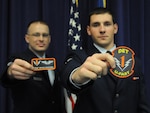 Staff Sgt. Bryan Buchorn (left) and Airman 1st Class Scott Mitchell, a pipeline Airman, are gaduates of the first Basic Sensor Operators Training couse to train pipeline Airmen fresh from basic training. Upon graduation, graduates receive their flight uniform patches.