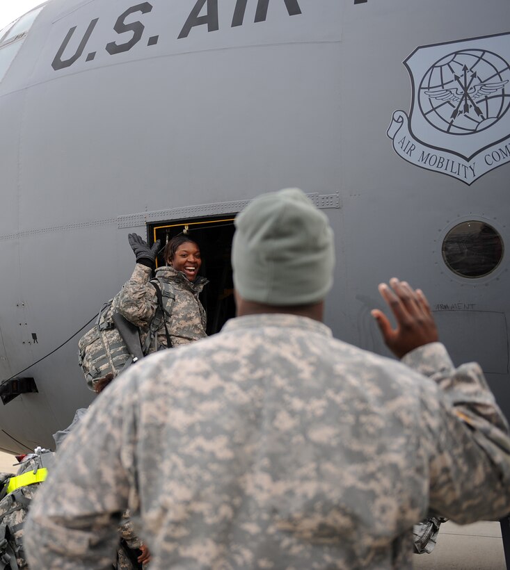 LANGLEY AIR FORCE BASE, Va. – Soldiers from Fort Lee, Va., wave goodbye as personnel board a C-130 Hercules Feb. 12.  The C-130 is transporting 47 soldiers, as well as supplies, to Haiti in support of Operation Unified Response, a joint relief effort bringing aid to the devastated country. (U.S. Air Force photo/Airman Rebecca Montez)