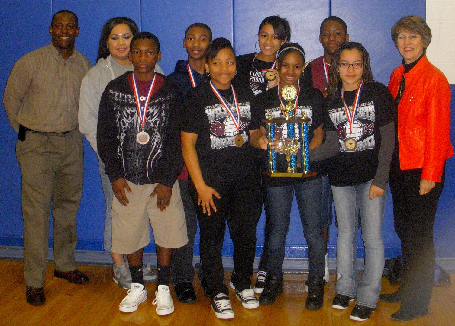 Students of Woodlake Hills Middle School show off their trophy and
individual medallions after winning their division in the annual African
American Heritage Knowledge Bowl at Randolph High School here. Competition judges, Maj. Gen. K.C. McClain, commander of the Air
Force Personnel Center, and Maj. William Collins, chairman of the African
American Heritage Committee, share the spotlight. This winning team
consisted of Krishae Wallace-Ball, Tiara Egglestin, Stephanie Santana,
Joshua Tyler, Cedric Williams, Ondrea Spearman and Willie Davis. The coach
was Teonna Rector. (Courtesy photo)
