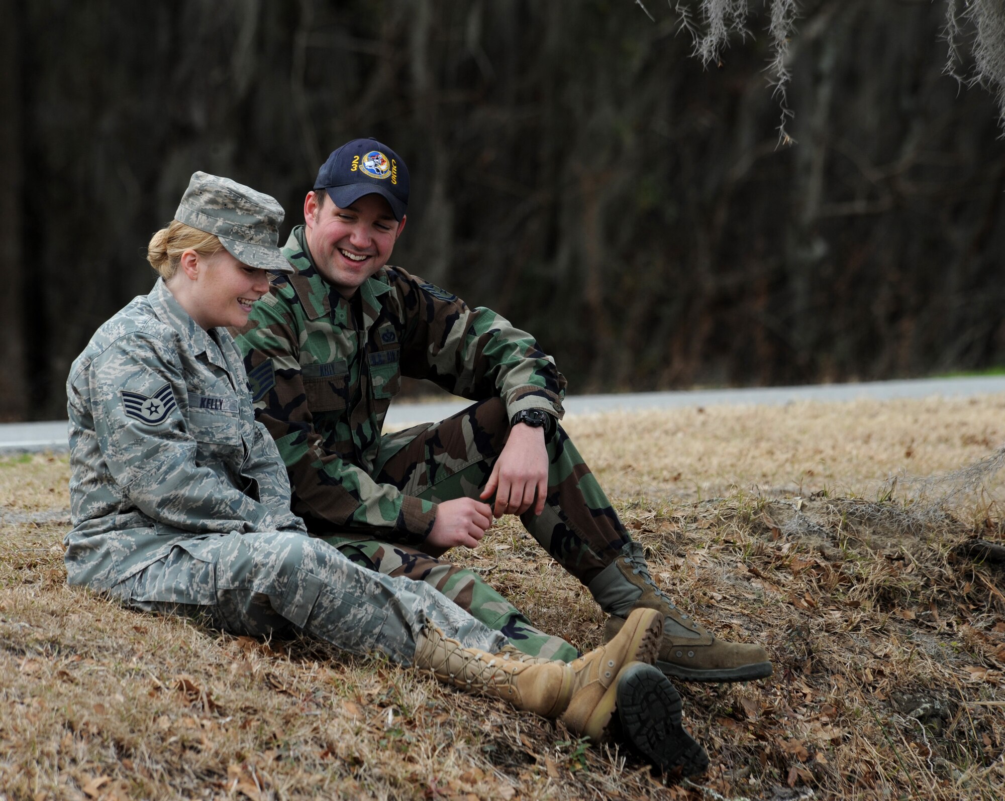 MOODY AIR FORCE BASE, Ga. -- Staff Sgt. Shonda Kelly, 23rd Fighter Group knowledge operator and Staff Sgt. Joshua Kelly, 23rd Civil Engineer Squadron electrical power production craftsman, sit next to Mission Lake here Feb. 11. For dual-military couples, the stress of separation during times such as deployments may strain a relationship, but this pair has discovered what communication techniques work for them to keep the spark in their marriage. (U.S. Air Force Photo by Airman 1st Class Benjamin Wiseman)