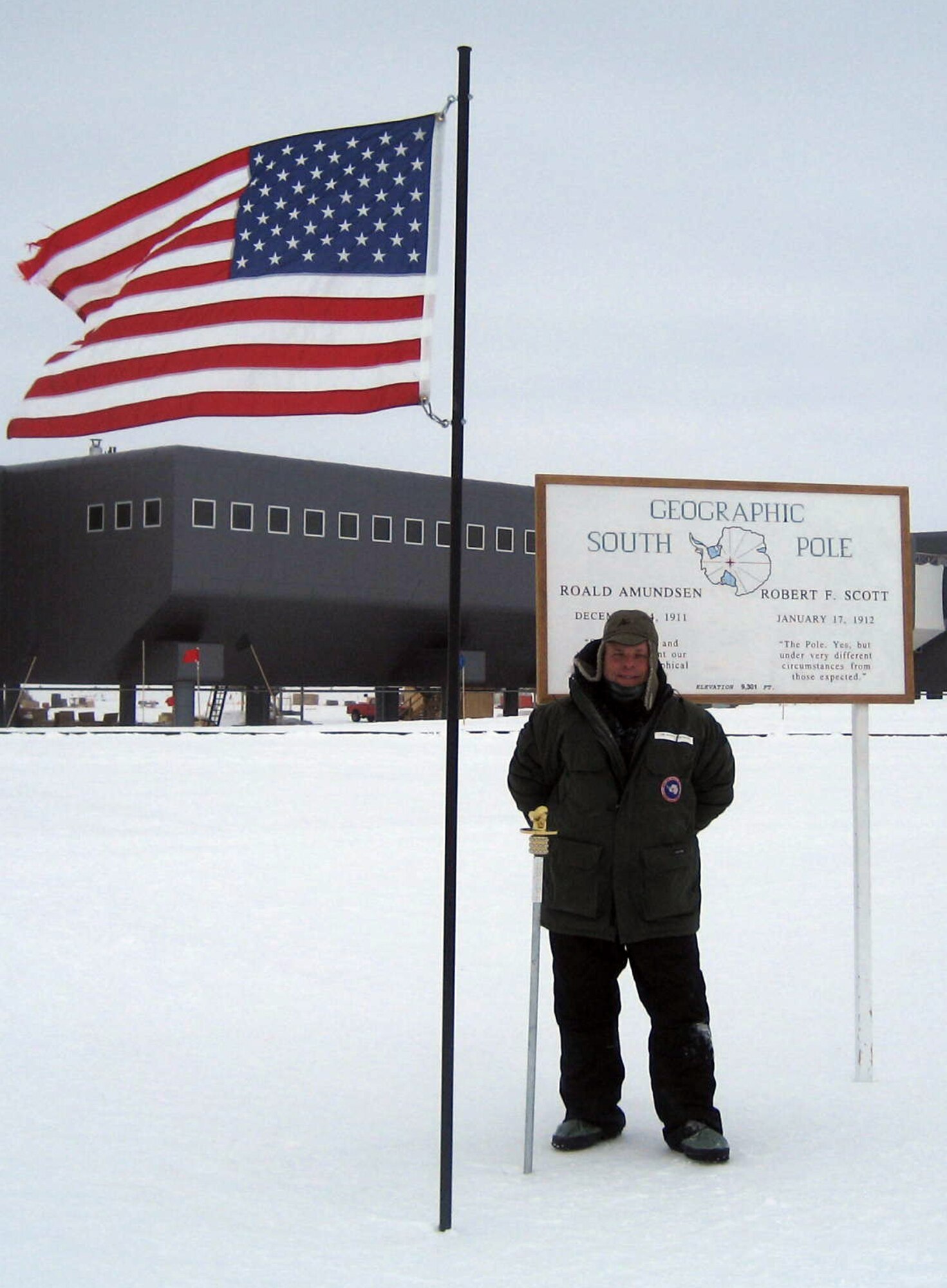 Cmdr. Scott Shackleton stands at the geographic South Pole during a brief visit to the remote location Feb. 9.  Commander Shackleton – a distant relative of the famous Antarctic explorer Sir Ernest Shackleton – is a Navy reservist assigned to MSC who just finished a tour supporting Operation Deep Freeze.  The operation is the Department of Defense’s logistical support to the National Science Foundation and U.S. Antarctica Program activities in Antarctica. (Courtesy photo)
