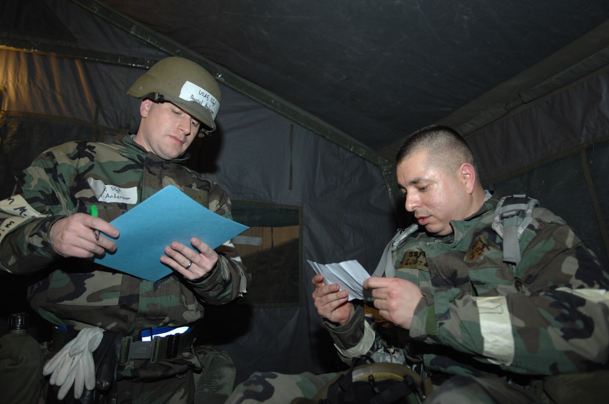 MINOT AIR FORCE BASE, N.D. -- Staff Sgt. Daniel Anderson, 5th Medical Operations Squadron public health technician, asks Staff Sgt. Gilbert Ozuna, 5th Logistics Readiness Squadron equipment accountability liaison, medical questions for triage purposes during the Prairie Knight 10-1 exercise Feb. 11 here. Prairie Knight is a semi-annual exercise geared to prepare the 5th Bomb Wing Warbirds for a conventional warfare environment and its August 2010 conventional operational readiness inspection. 