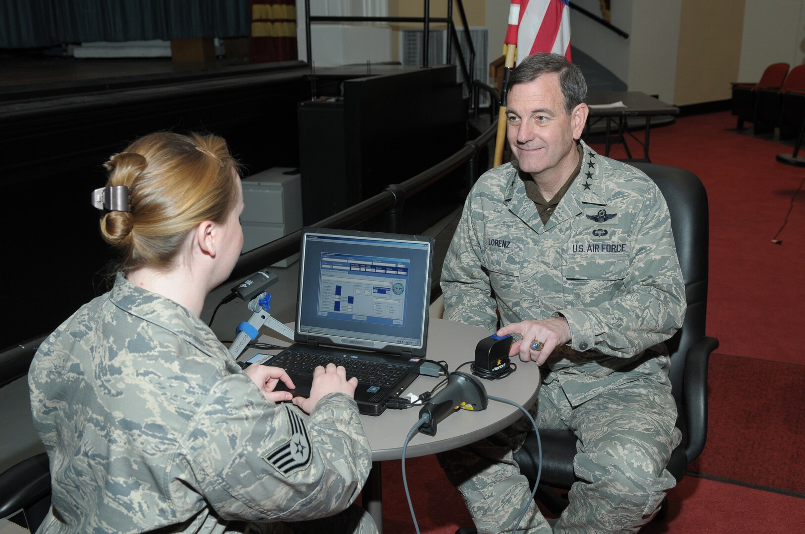 Staff Sgt. Whitney Howe, 902nd Security Forces, registers Gen. Stephen Lorenz, Air Education and Training Command commander on the Defense Biometrics Identification System, at Randolph AFB TX. (U.S. Air Force Photo by Joel Martinez) 
Date: 12 Feb 2010