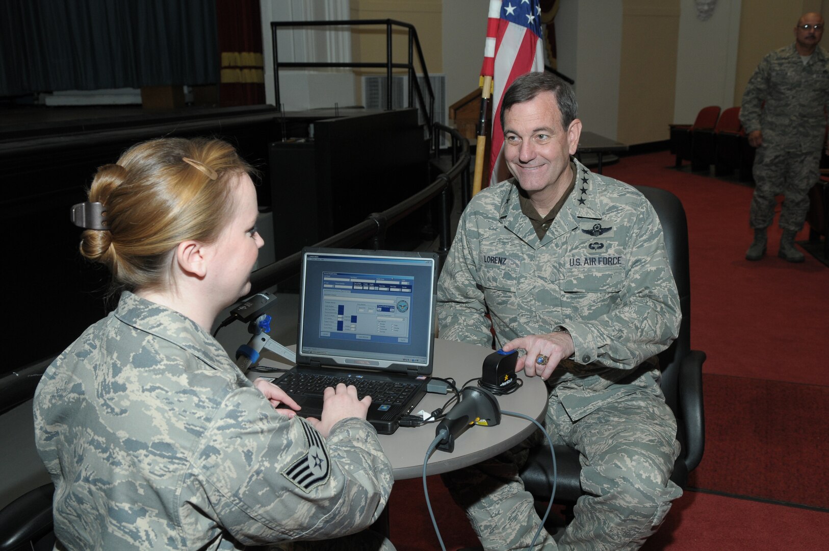Staff Sgt. Whitney Howe, 902nd Security Forces, registers Gen. Stephen Lorenz, Air Education and Training Command commander, in the Defense Biometrics Identification System at Randolph AFB, TX. (U.S. Air Force Photo by Joel Martinez) Date: 12 Feb 2010