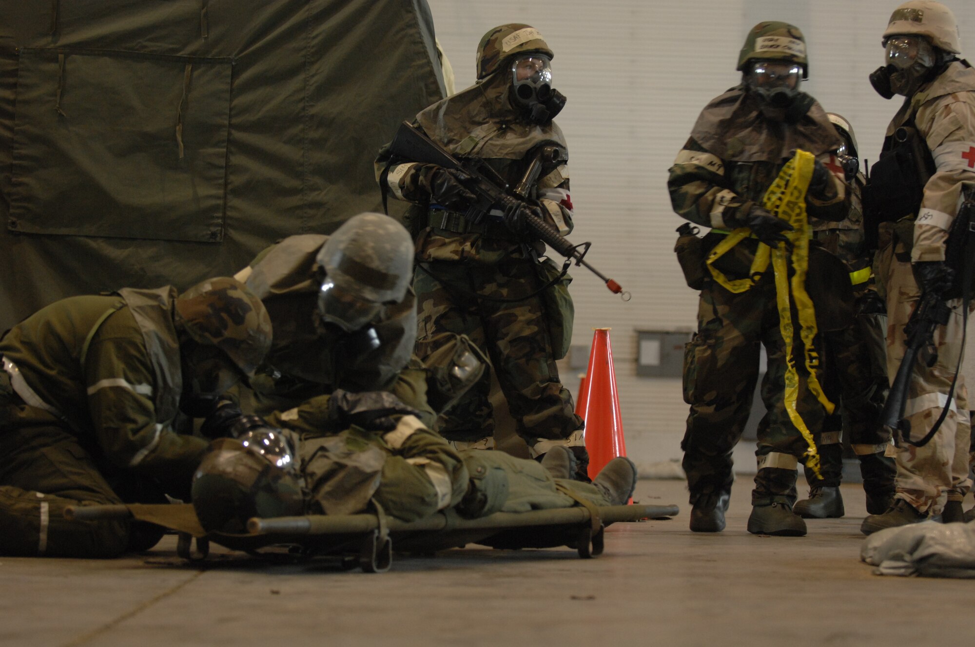 MINOT AIR FORCE BASE, N.D -- Airmen Carry a simulated victim to safety during an attack, during the Prairie Knight 10-1 Exercise here, Feb 11. Prairie Knight is an exercise designed to demonstrate unit capability to conduct sustained combat and mission support operations under simulated combat conditions (U.S. Air Force photo by Airman 1st Class Aaron-Forrest Wainwright)