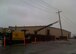 ALTUS AIR FORCE BASE, Okla. -- A line truck holds up a power pole at the cargo movement building Feb. 28. A severe ice storm swept through the area leaving the base without power. Parts of the base went without power for more than a week. (U.S. Air Force photo/Col. Ty Thomas)
