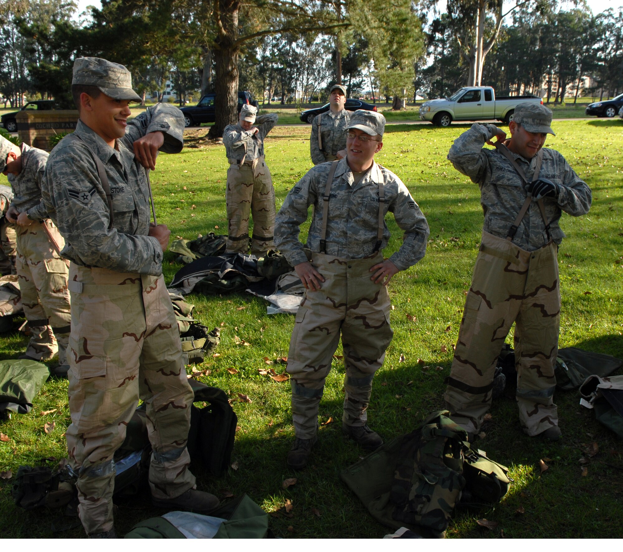 VANDENBERG AIR FORCE BASE, Calif. -- Members of Team Vandenberg learn how to properly adjust Mission Oriented Protective Posture gear during a North Star exercise at Cocheo Park here Thursday, Feb. 10, 2010. North Star is used to test each Airman's knowledge of self-aid and buddy care, force protection levels, terrorist attacks and many other situations that may arise in a deployed location. (U.S. Air Force photo/Airman 1st Class Kerelin Molina)