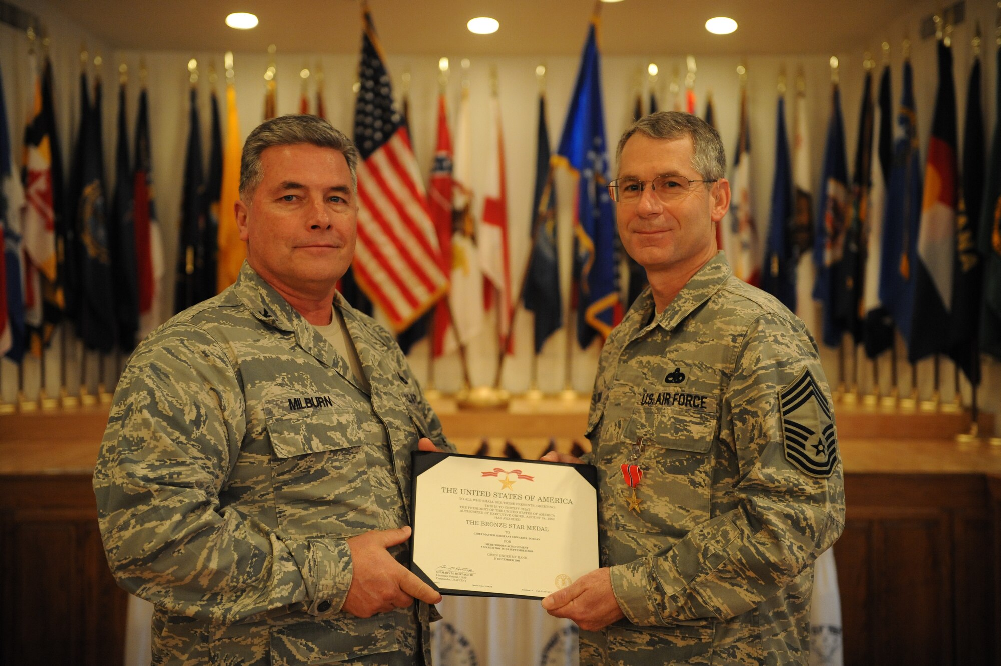 DYESS AIR FORCE BASE, Texas -- Col. James Milburn, 7th Maintenance Group Commander, presents the Bronze Star Medal to Chief Master Sergeant Edward Jordan, 7th Maintenance Group Superintendent, Jan. 22. Chief Jordan received the medal for his actions while deployed in support of Operation Enduring Freedom. He received the fourth-highest combat award while working in the 455th Expeditionary Maintenance Group as the 455th Expeditionary Wing Superintendant. (U.S Air Force photo/ Airman 1st Class Shannon Hall)