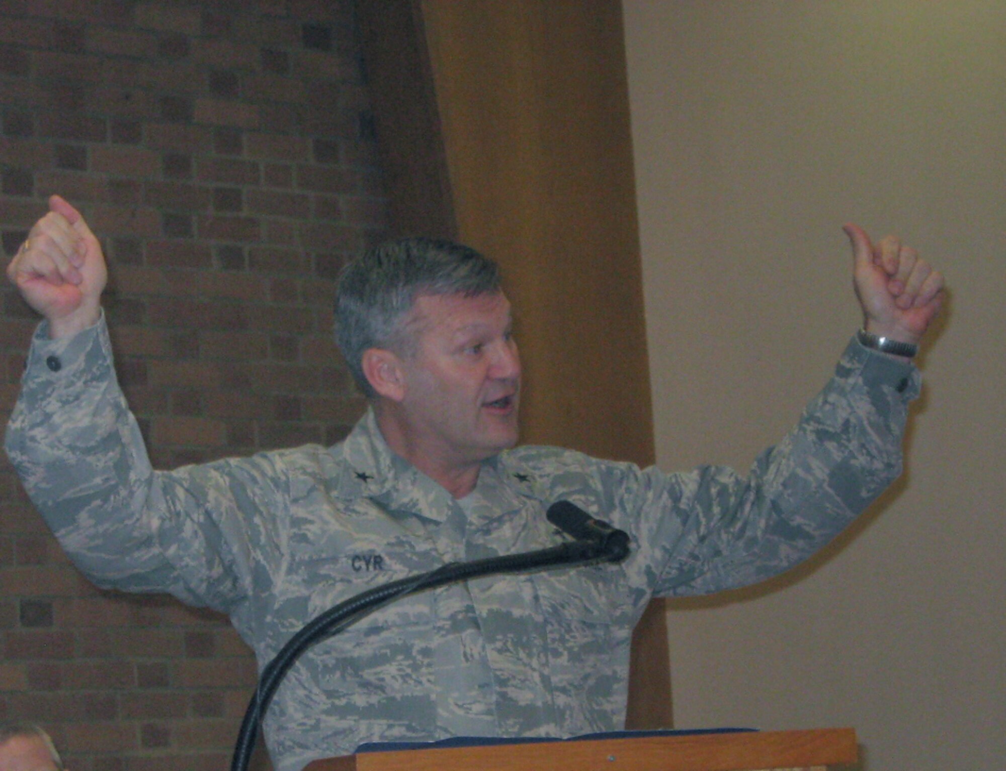 Chaplain (Brig. Gen.) David Cyr, Air Force deputy Chief of Chaplains and guest speaker for RAF Lakenheath’s National Prayer Breakfast, delivers his speech at the base chapel Feb. 12.   Chaplain Cyr’s message focused on the words “God Bless America”.  He said the phrase is more than a song title or closing statement, and asked Liberty warriors to see it as a prayer, as in “God, bless America”, this year as they participate in the National Prayer Breakfast.(U.S. Air Force photo/Capt. Alysia Harvey) 
