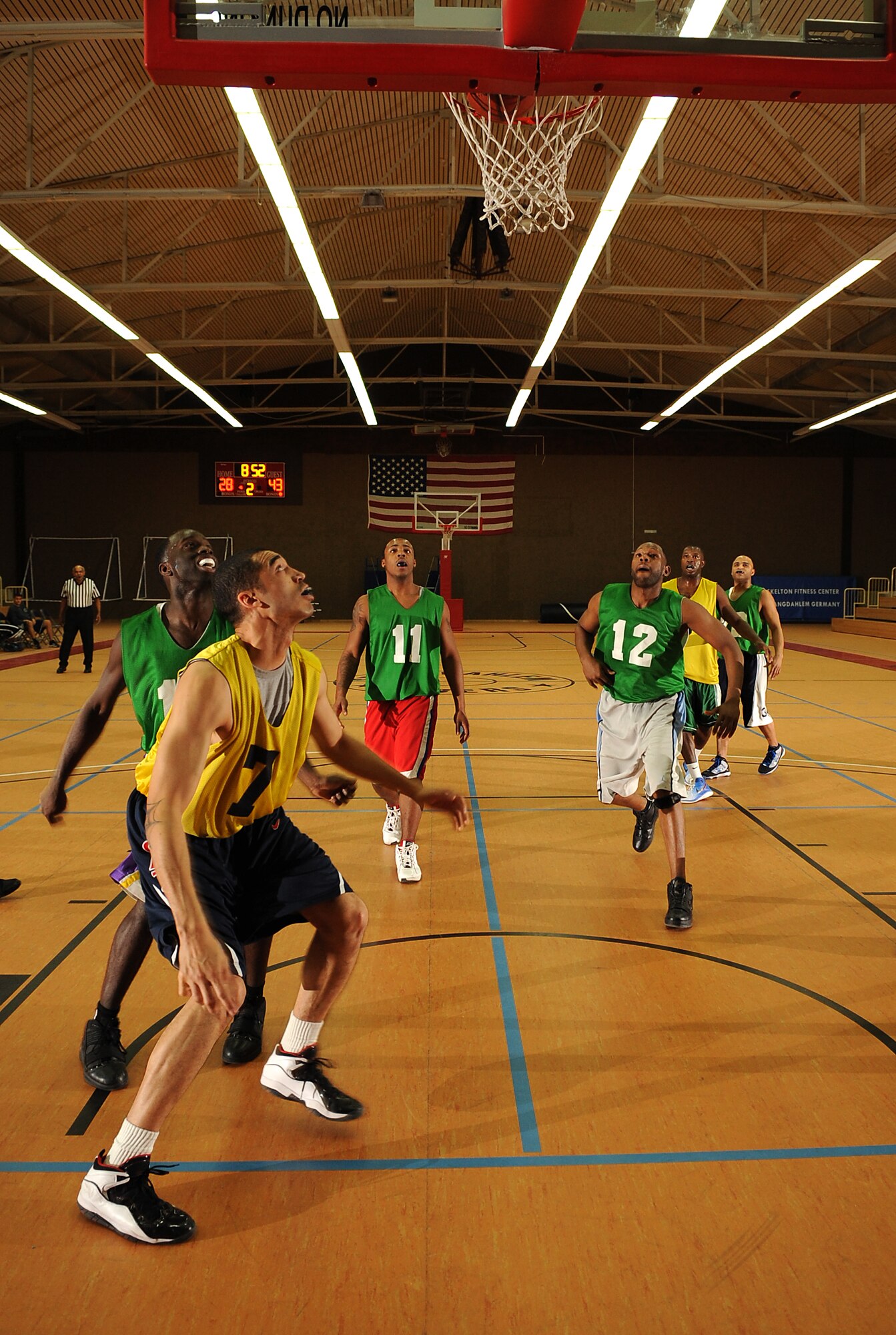 SPANGDAHLEM AIR BASE, Germany – Players wait to rebound the basketball during the first game of the intramural basketball championship series here Feb. 11. The 52nd Communications Squadron defeated the 52nd Security Forces Squadron 57-36 in the first game and 73-67 in overtime the second game, winning the championship title. This is the squadron’s third consecutive championship title. (U.S. Air Force photo/Senior Airman Nathanael Callon)