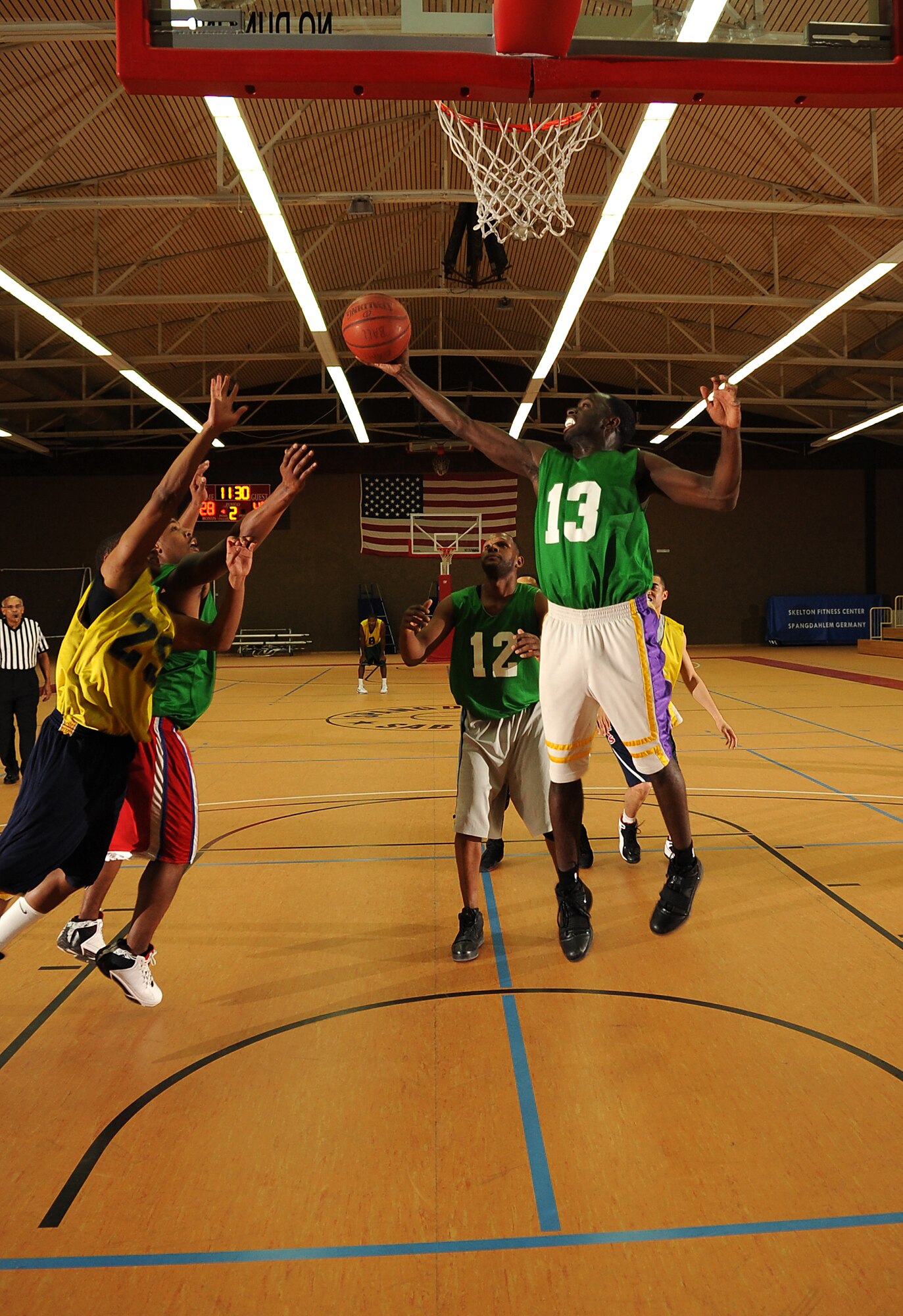 SPANGDAHLEM AIR BASE, Germany – Senior Airman Artis Gandy, 52nd Communications Squadron, rebounds the ball during the first game of the intramural basketball championship series here Feb. 11. The 52nd CS defeated the 52nd Security Forces Squadron 57-36 in the first game and 73-67 in overtime the second game, winning the championship title. This is the squadron’s third consecutive championship title. (U.S. Air Force photo/Senior Airman Nathanael Callon)