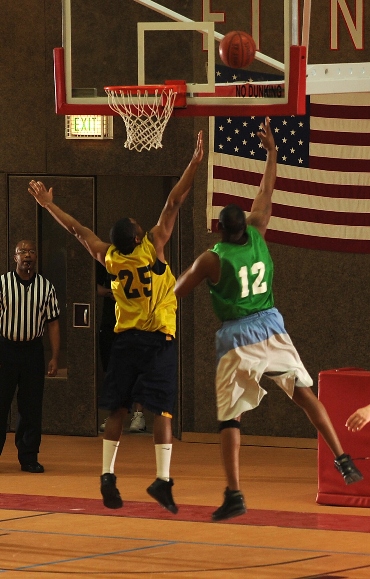 SPANGDAHLEM AIR BASE, Germany – Staff Sgt. Ternae Riley, right, 52nd Communications Squadron, attempts to score over Senior Airman James Watkins, 52nd Security Forces Squadron, during the first game of the intramural basketball championship series here Feb. 11. The 52nd CS defeated the 52nd SFS 57-36 in the first game and 73-67 in overtime the second game, winning the championship title. This is the squadron’s third consecutive championship title. (U.S. Air Force photo/Senior Airman Nathanael Callon)