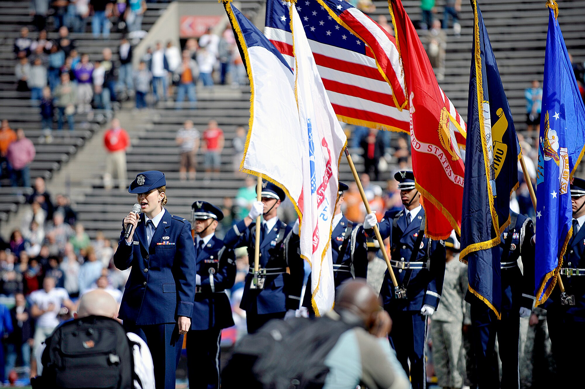 EL PASO, Texas-- 2nd Lt. Jennifer Lindberg, 49th Aircraft Maintenance Squadron, sings the national anthem as a part of the opening ceremony at the Texas vs. the Nation held at the Sun Bowl, Feb. 6. Lieutenant Lindberg was one of many Holloman Air Force Base representatives present at the game. (U.S. Air Force photo by Staff Sgt. Anthony Nelson)