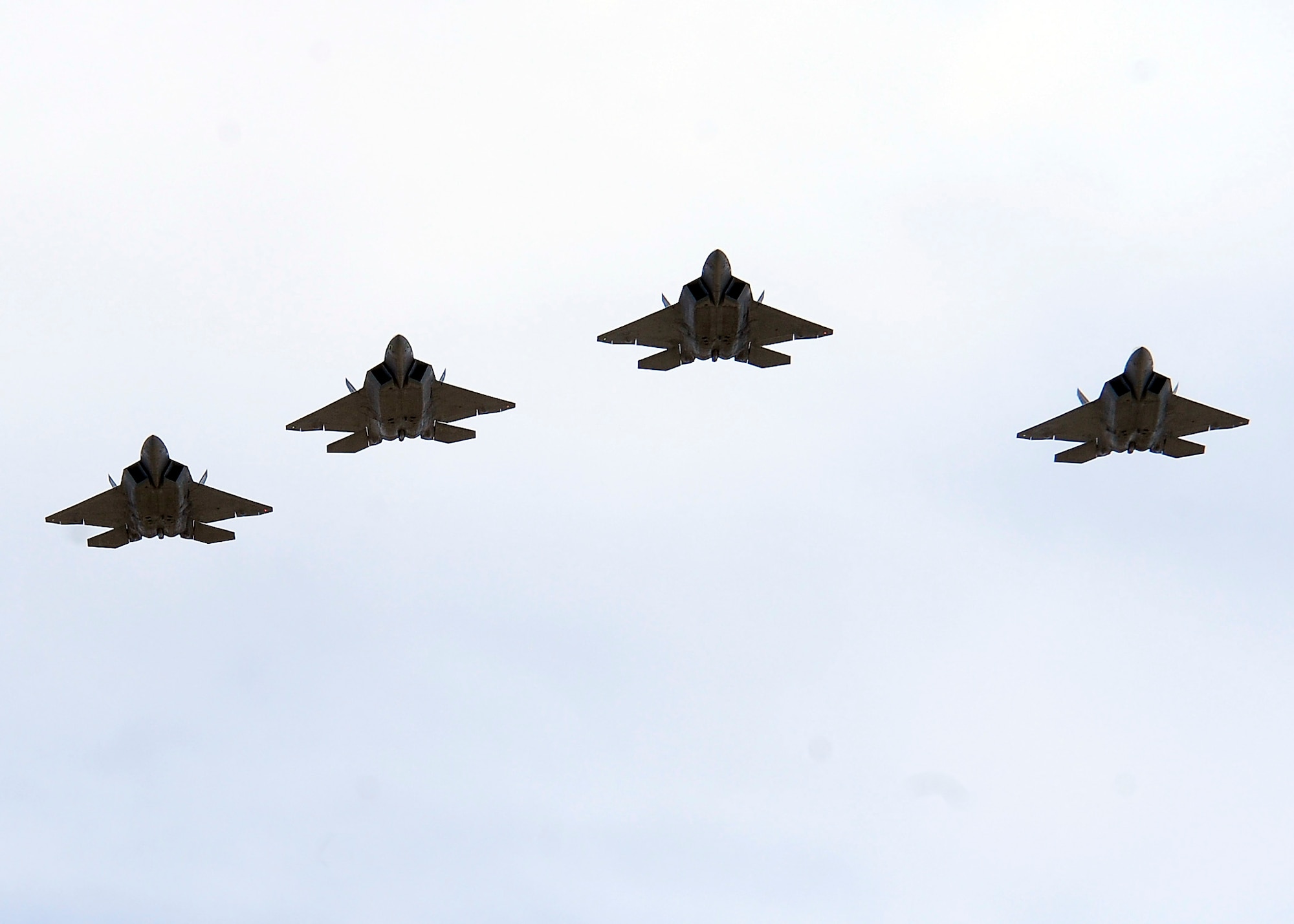 EL PASO, Texas -- A formation of F-22 Raptors from the 44th Fighter Group at Holloman Air Force Base, N.M., perform a flyover as part of the opening ceremony at the Texas vs. the Nation football game held at the Sun Bowl, Feb. 6. Many members of Holloman AFB were there to support the game including the Steel Talon Honor Guard who presented the colors in the opening ceremony. (U.S. Air Force photo by Senior Airman DeAndre Curtiss)