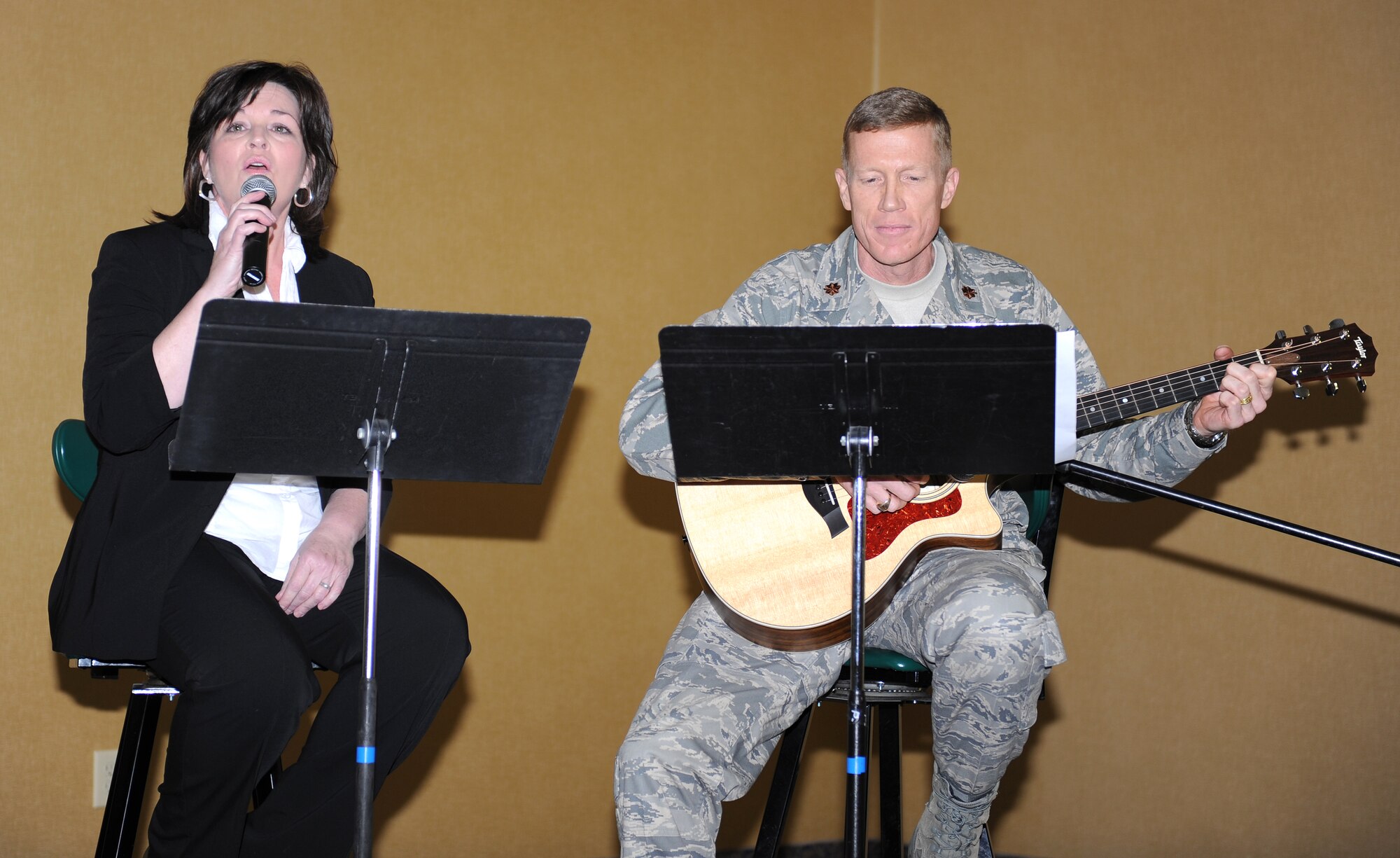 ELLSWORTH AIR FORCE BASE, S.D.- Molly Ellis, spouse of Chaplain (Lt. Col.) Norman Ellis, and Chaplain (Maj.) Mark Bowditch, Senior Protestant Chaplain, play "The Father's Song" during the Ellsworth  National Prayer Luncheon, Feb. 10. The theme of the 2010 Ellsworth National Prayer Luncheon was “the God who answers.”  (U.S. Air Force photo/Master Sgt. Loren J. Bonser)