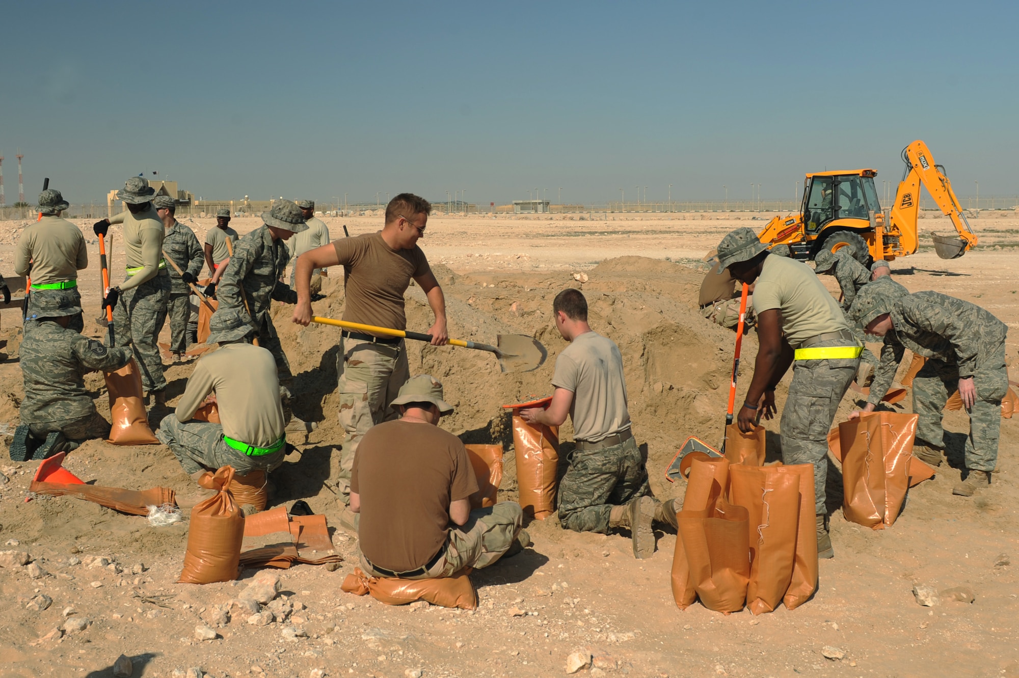 Airmen fill sandbags as part of a base-wide effort to replace roughly 34,000 deteriorated sandbags at a non-disclosed Southwest Asia location, Feb. 9, 2010. (U.S. Air Force photo by Tech. Sgt. Michelle Larche)[RELEASED]