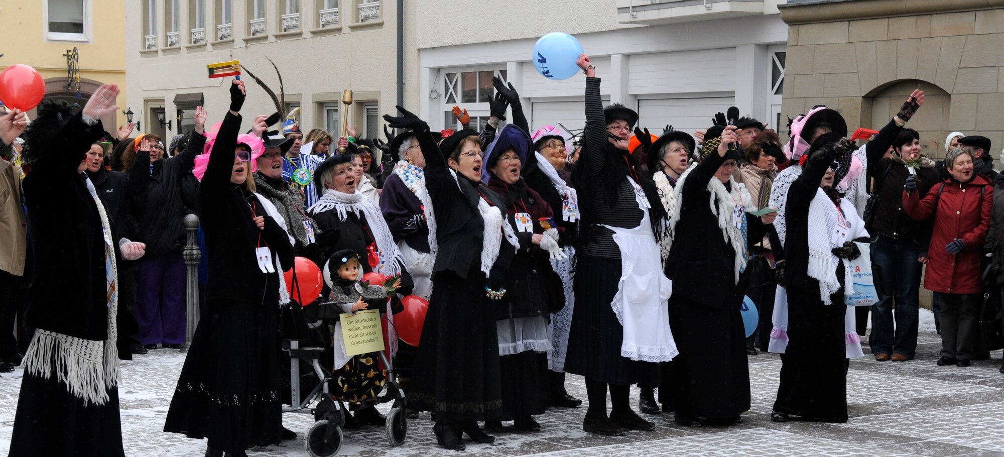 SPANGDAHLEM AIR BASE, Germany –Women from Bitburg cheer during the storming of the Rathaus, or town hall, Feb.11. 52nd Fighter Wing members took part in the celebration and assisted Joachim Kandels, Bitburg mayor, in defending the key. Once the women got the key, they also took control of the city for the rest of the day. The storming marks Weiberdonnerstag, or the first day of Fasching. (U.S. Air Force photo/Airman 1st Class Staci Miller)