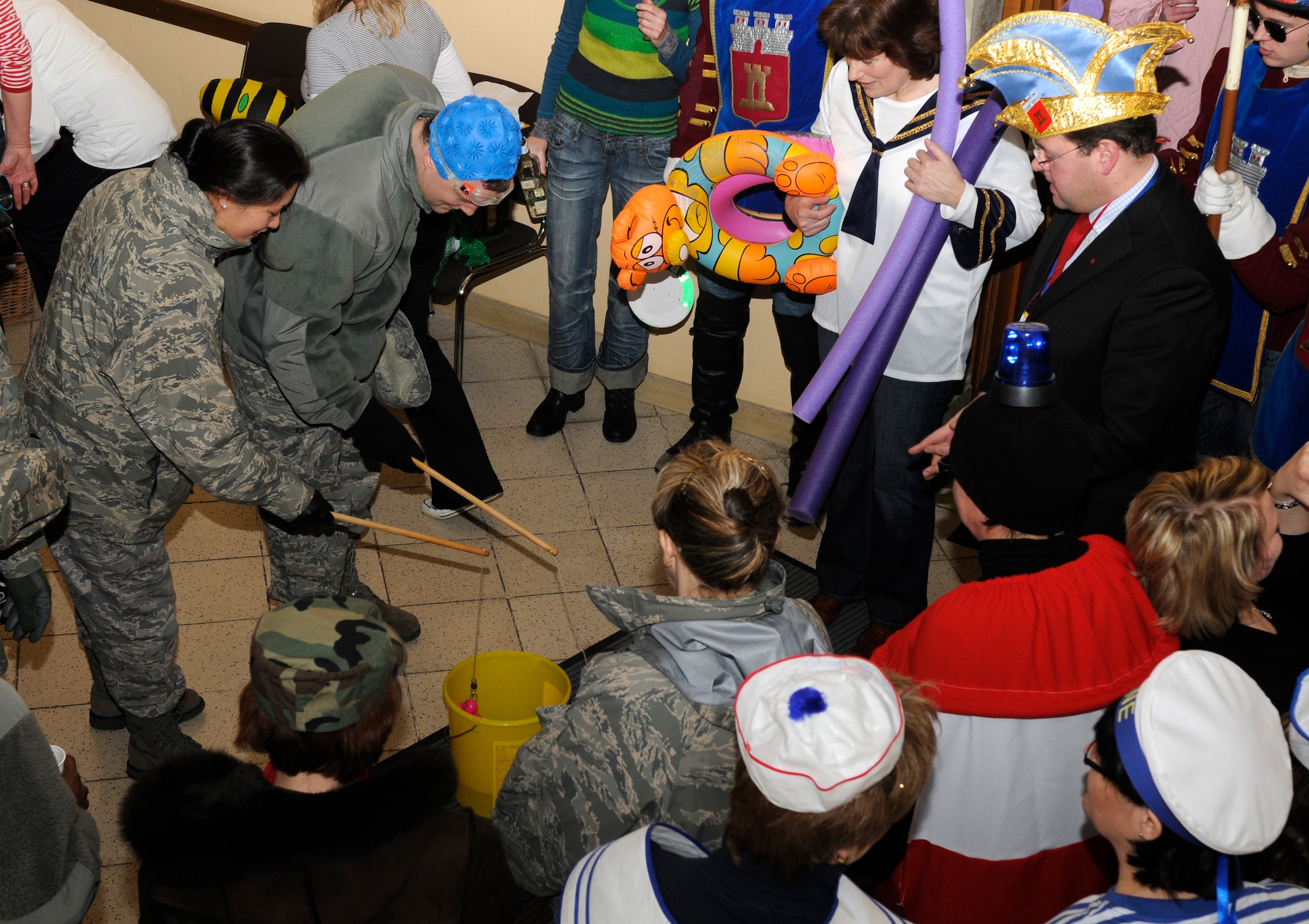 SPANGDAHLEM AIR BASE, Germany – Joachim Kandels, right, Bitburg mayor, looks on as 52nd Fighter Wing members and women from the Bitburg community play games before taking part in the storming of the Rathaus, or town hall, Feb. 11. The storming marks Weiberdonnerstag, or the first day of Fasching. (U.S. Air Force photo/Airman 1st Class Staci Miller)