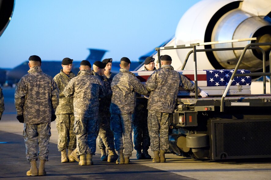 8 February 2010  USAF Photo by Jason Minto.  A U.S. Army carry team transfers the remains of Army PFC Charles A. Williams of Fair Oaks, CA at Dover Air Force Base, Del., Feb 8, 2010.  