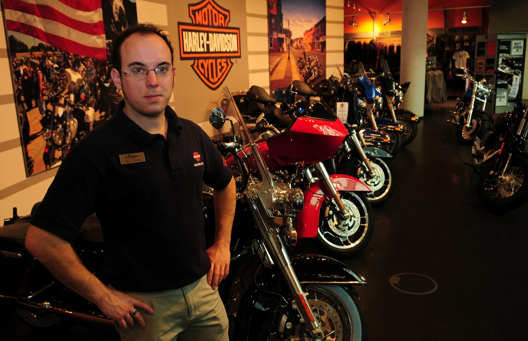 Dan Kelly, Harley Davidson representative, poses for a photo in his work area at the KMCC on Ramstein Air Base, Germany, Feb.9, 2010. The store is located on the second floor of the KMCC, across from the Reel Time Theater. (U.S. Air Force photo by Airman Desiree Esposito)