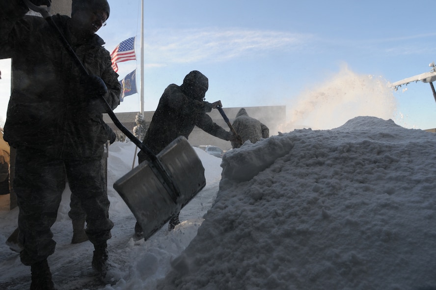 Cheif Master Sergeant Kenny Souders, Master Sergeant Tony Powell and Technical Sergeant Timothy Whalen work together to move a mound of snow that had accumulated in front of the headquarters building of the 193rd Special Operations Wing, PA Air National Guard, Middletown Pennsylvania. The Harrisburg area recieved 36 inches of snow from two storms that blanketed the area in the last week. (U.S. Air Force photo by Senior Master Sergeant David Hawkins/Released)