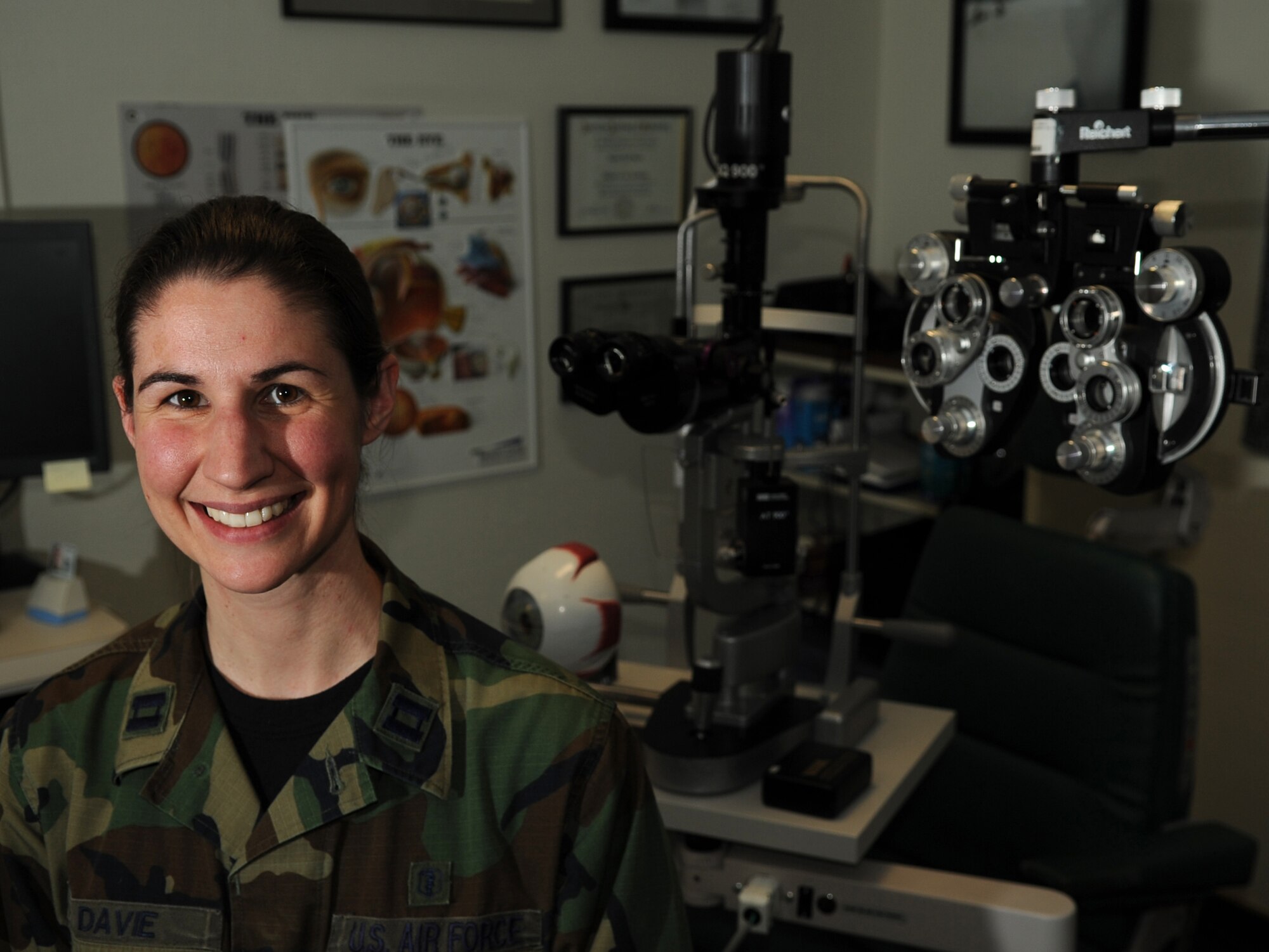 U.S. Air Force Capt. Laurie Davie, 86th Aerospace Medicine Squadron optometrist, poses for a photo in her work station, Ramstein Air Base, Germany, Feb. 9, 2010.  The Ramstein Optometry Clinic staff sees an estimated 50 patients a day ensuring mission readiness service members and their families. (U.S. Air Force photo by Airman 1st Class Caleb Pierce)