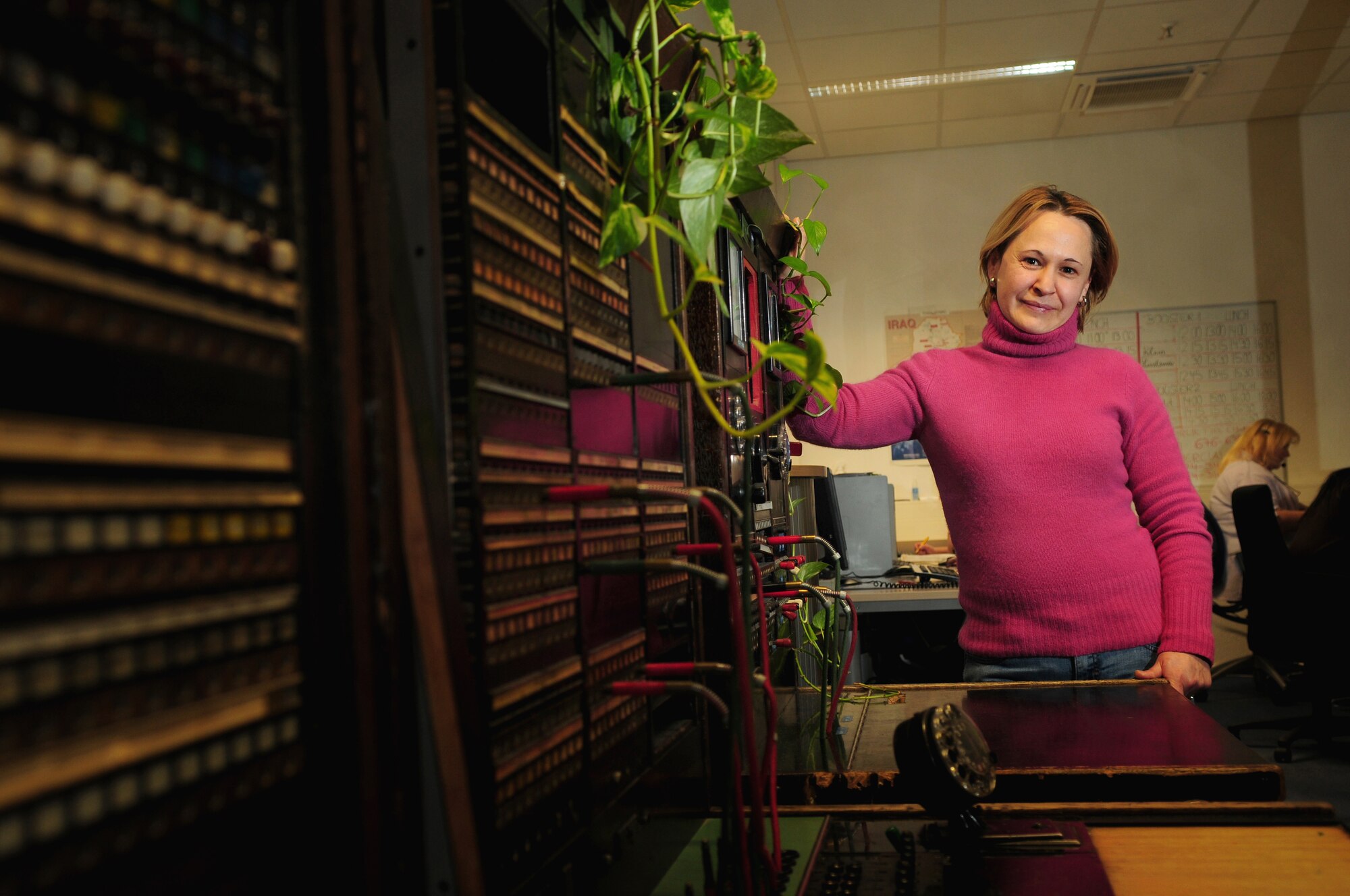 Maria Caetano, supervisor, USAFE European consolidated Ramstein switchboard, poses for a photo in her work area on Ramstein Air Base, Germany, Feb.9, 2010. The operators process 3.5 Millions phone calls per year. Fourty-five employees are multi-lingual in the work center. (U.S. Air Force photo by Airman Desiree Esposito)
