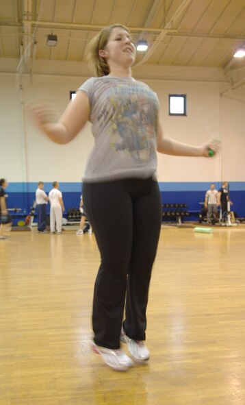 Jessica Andreasen, Air Force spouse, completes 300 sets with the jump rope during a work-out session with her personal trainer at the Northside Fitness Center, Ramstein Air Base, Germany, Feb. 10, 2010. Mrs. Andreasen is competing in the fourth-annual Biggest Loser Competition. (U.S. Air Force photo by Senior Airman Amanda Dick)