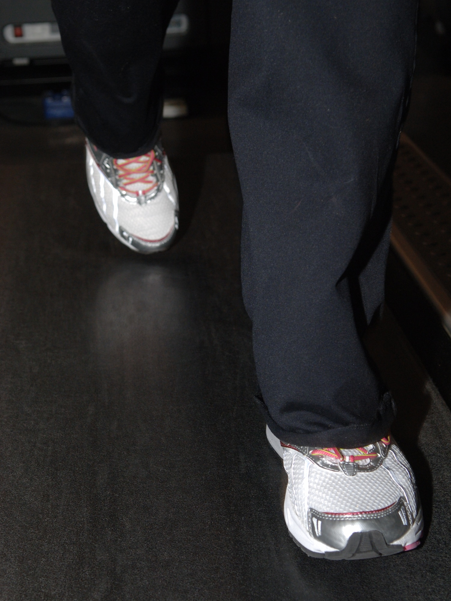 Jessica Andreasen, Air Force spouse, runs on the treadmill during a work-out session with her personal trainer at the Northside Fitness Center, Ramstein Air Base, Germany, Feb. 10, 2010. Mrs. Andreasen is competing in the fourth-annual Biggest Loser Competition. (U.S. Air Force photo by Senior Airman Amanda Dick)