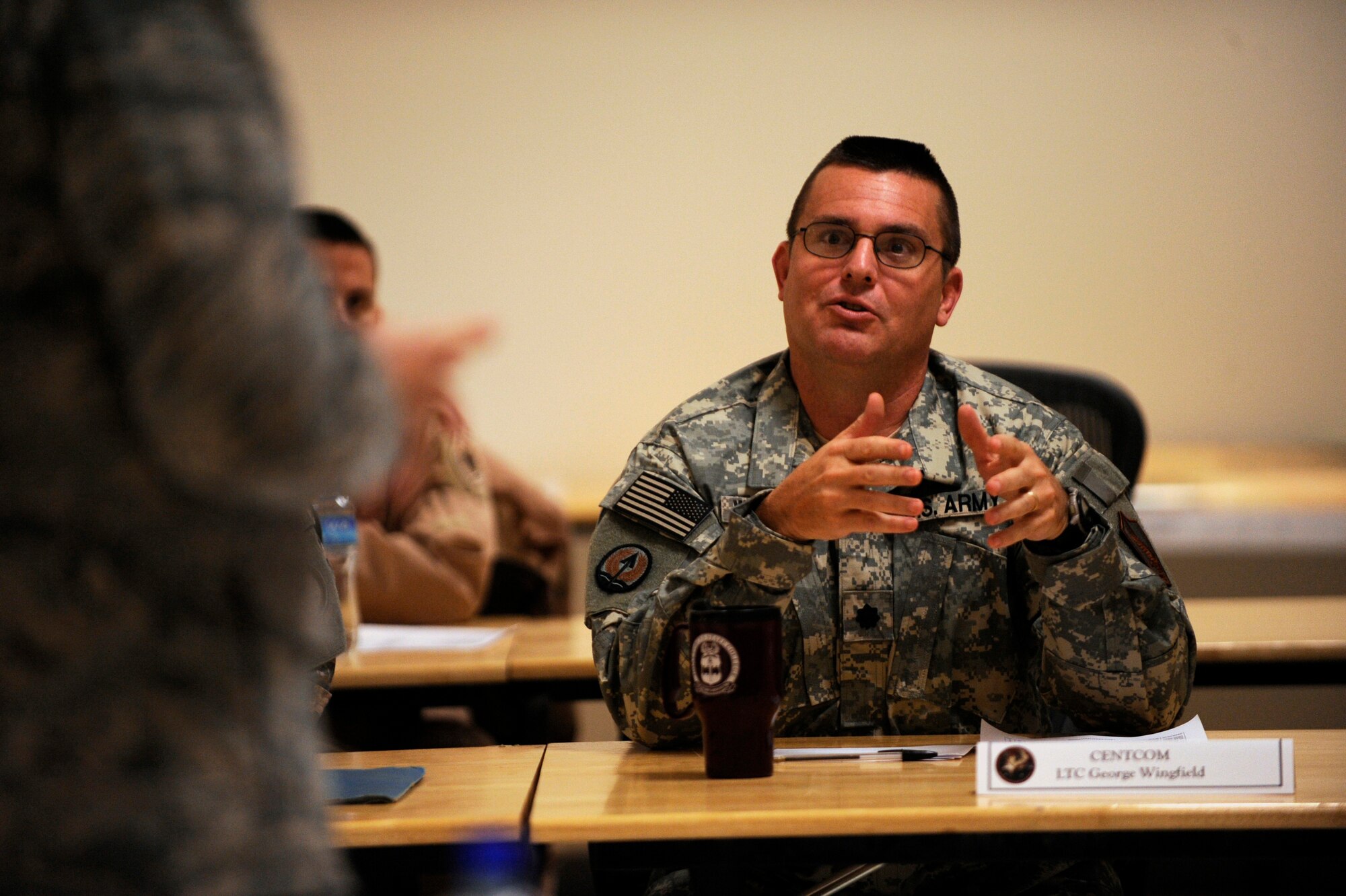 U. S. Army Lt. Col. George Wingfield asks Maj. Gen. Stephen L. Hoog, deputy commander, U.S. Air Forces Central Command; deputy, Combined Force Air Component commander, U.S. Central Command, a question during the Theater Space Conference,  Feb. 8, 2010, at a base in Southwest Asia.  (U.S. Air Force photo/Staff Sgt. Manuel J. Martinez/released)
