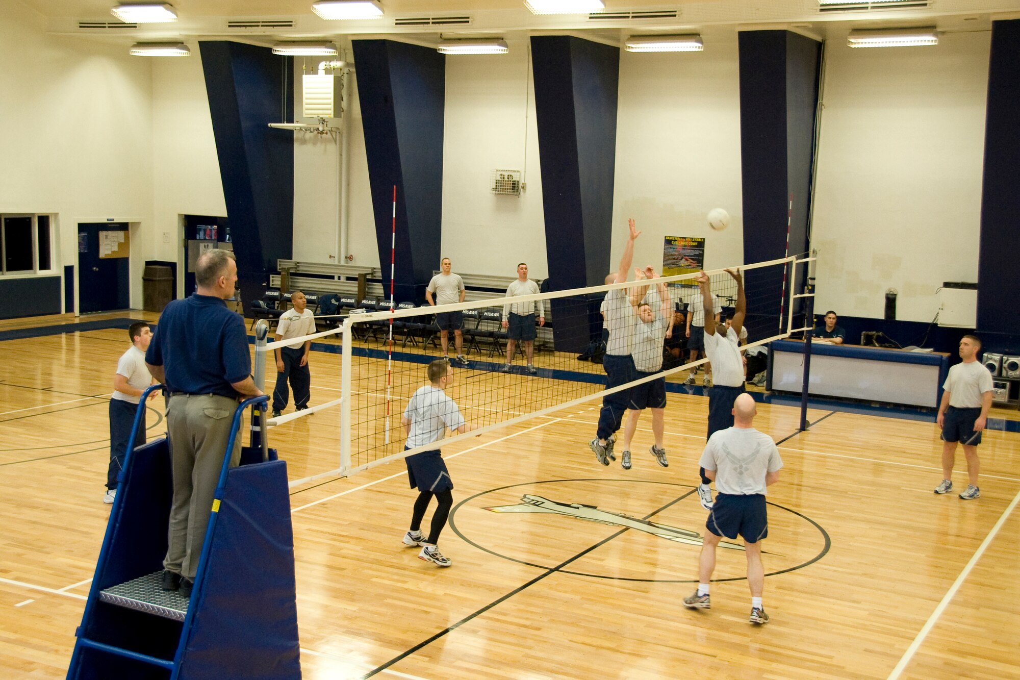 MISAWA AIR BASE, Japan -- Members of the Airman Leadership School class 10-B and base leadership faceoff in a game of volleyball Feb. 10 at the Potter Fitness Center. The class trained and prepared 24 of the Air Force's future leaders for the next stage in their careers. The ALS class won two of the three games played. (U.S. Air Force photo/Senior Airman Jamal D. Sutter)