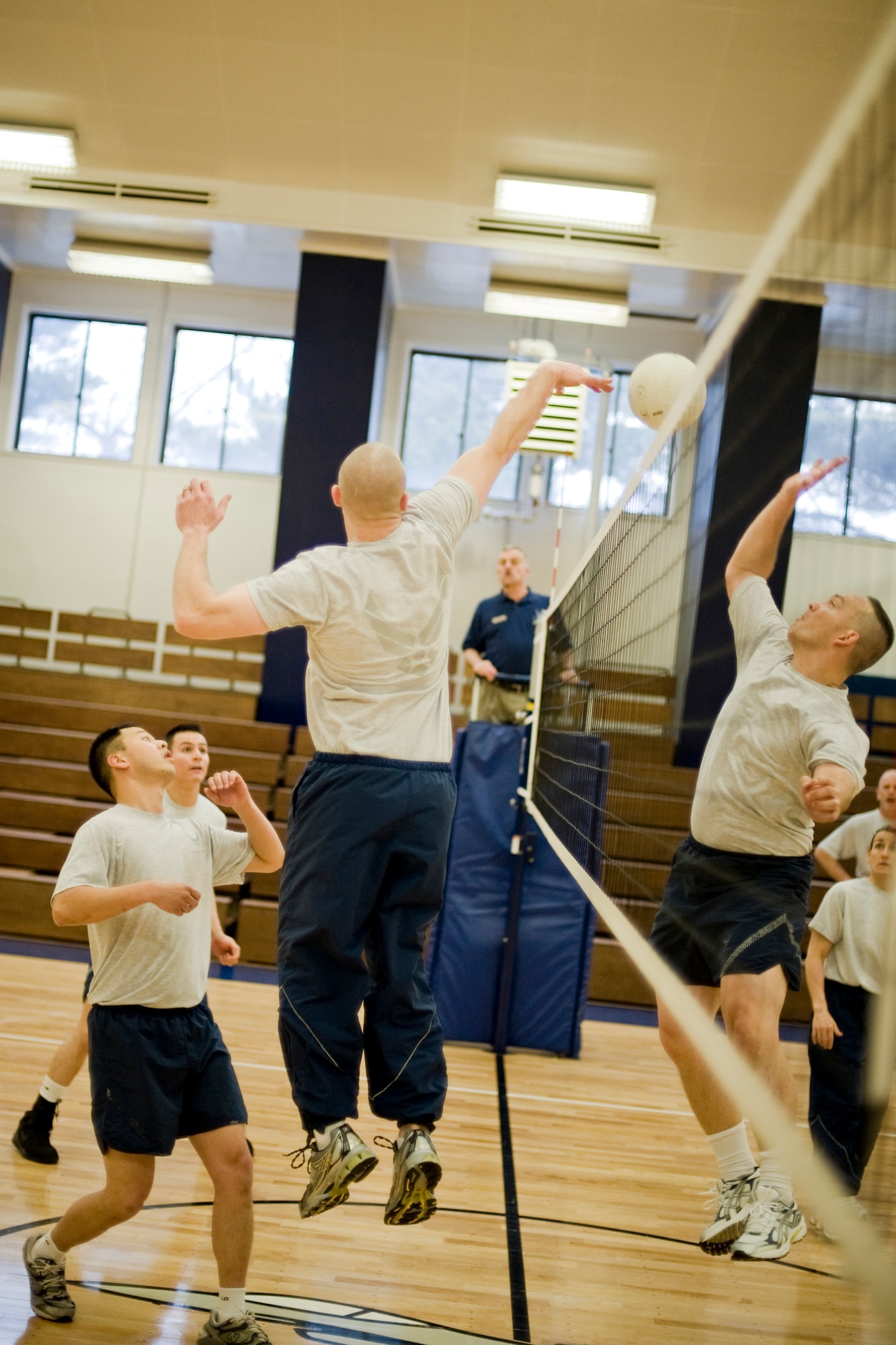 MISAWA AIR BASE, Japan -- Members of the Airman Leadership School class 10-B and base leadership faceoff in a game of volleyball Feb. 10 at the Potter Fitness Center. Volleyball games against base leadership are a tradition at the Misawa ALS, with the golden volleyball trophy being presented to the winning team on graduation night. The ALS class won two of the three games played. (U.S. Air Force photo/Senior Airman Jamal D. Sutter)