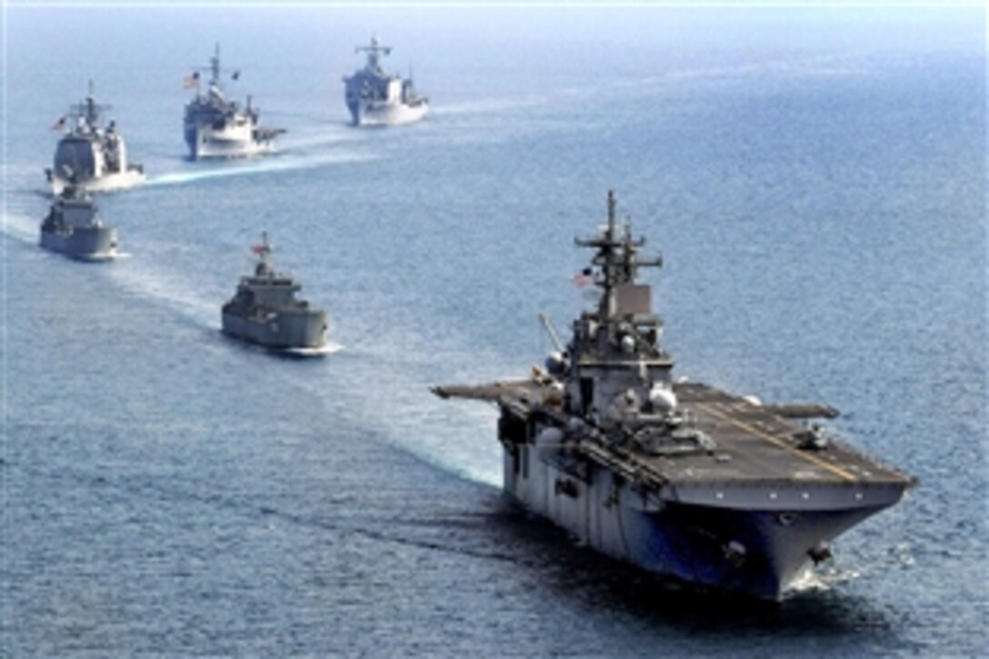 The amphibious assault ship USS Essex, the Royal Thai navy medium landing ship HTMS Surin, the Republic of Korea navy tank landing ship Seongin Bong, the guided-missile cruiser USS Shiloh, the amphibious dock landing ship USS Harpers Ferry and the amphibious transport dock ship USS Denver transit in formation during exercise Cobra Gold in the Gulf of Thailand, Feb. 10, 2010.