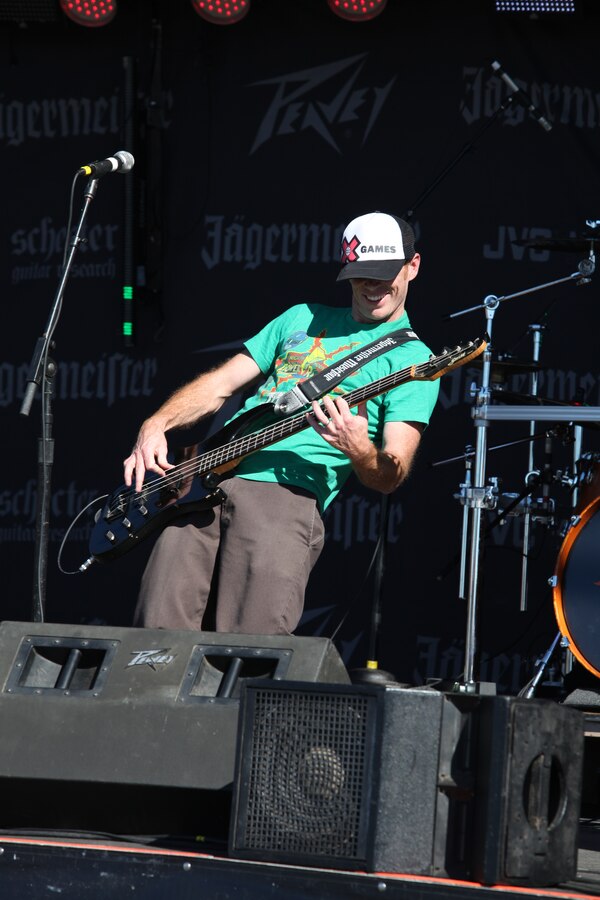 A member of the band Safety Orange performs on stage for thousands of visitors during the Centennial of Naval Aviation Feb. 12.