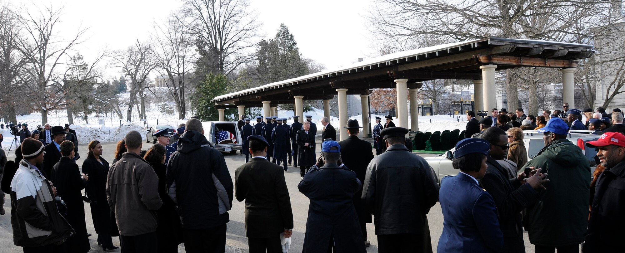 The United States Air Force Honor Guard renders full military honors during the funeral for retired Lt. Col. Lee Archer Feb. 12, 2010, at Arlington National Cemetery in Arlington, Va. Colonel Archer, who died at age 90, was a member of the famed Tuskegee Airmen and flew some 169 combat missions during World War II. Although the cemetery was closed to the public, following about a 30-inch snowfall accumulation, the USAF Honor Guard rendered honors during seven funerals, ensuring no servicemember was laid to rest without the proper respect. (U.S. Air Force photo by Senior Airman Alexandre Montes/Released)