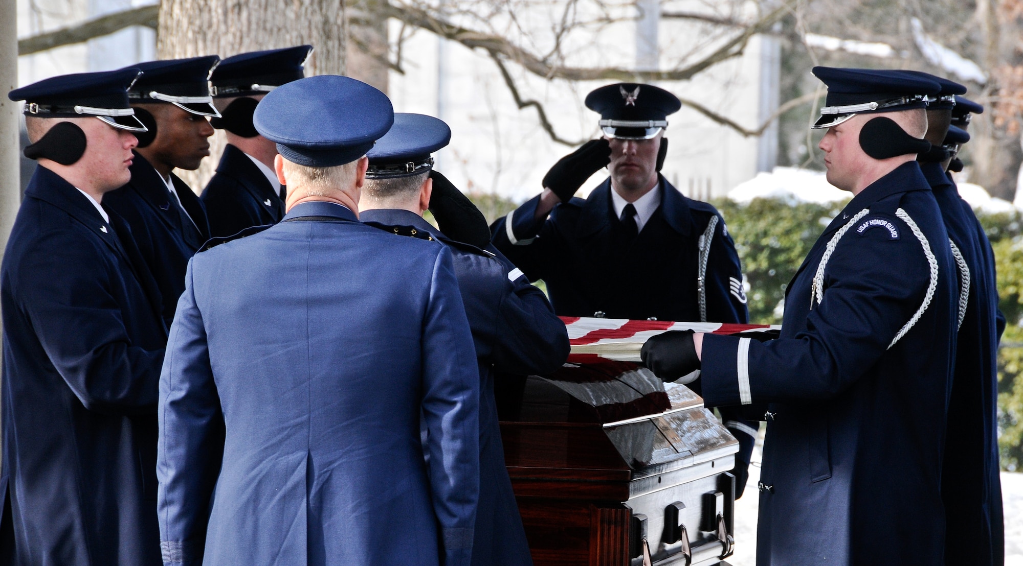The United States Air Force Honor Guard renders full military honors during the funeral for retired Lt. Col. Lee Archer Feb. 12, 2010, at Arlington National Cemetery in Arlington, Va. Colonel Archer, who died at age 90, was a member of the famed Tuskegee Airmen and flew some 169 combat missions during World War II. Although the cemetery was closed to the public, following about a 30-inch snowfall accumulation, the USAF Honor Guard rendered honors during seven funerals, ensuring no servicemember was laid to rest without the proper respect. (U.S. Air Force photo by Senior Airman Alexandre Montes/Released)
