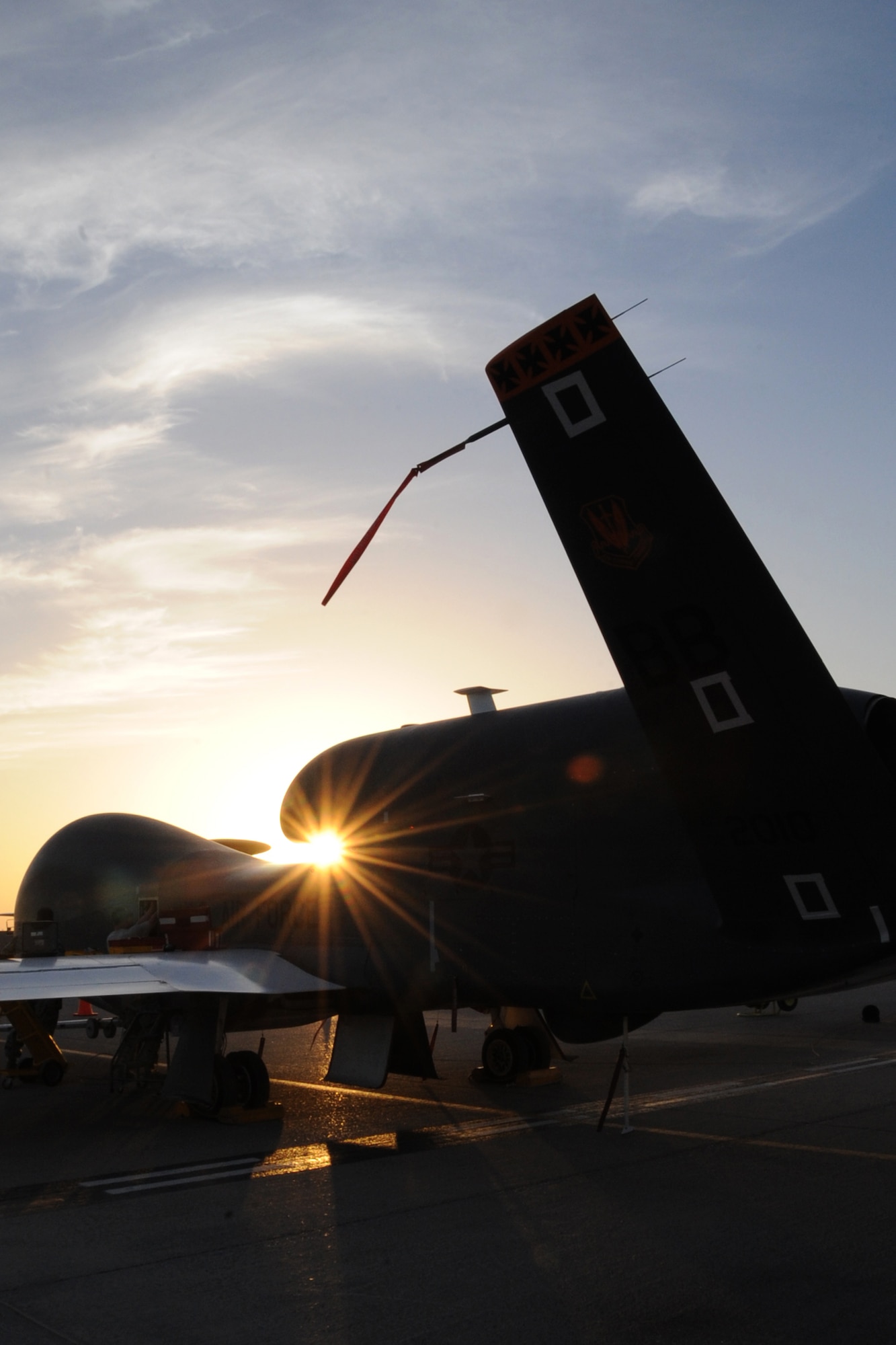 The RQ-4 Global Hawk sits on the runway as it is being prepared to take off for an overnight mission at an undisclosed location in Southwest Asia on Feb.12, 2010. The RQ-4 Global Hawk is a high-altitude, long-endurance unmanned aircraft system with an integrated sensor suite that provides intelligence, surveillance and reconnaissance, or ISR, capability worldwide. Global Hawk's mission is to provide a broad spectrum of ISR collection capability to support joint combatant forces in worldwide peacetime, contingency and wartime operations.  (U.S. Air Force photo/Senior Airman Jenifer H. Calhoun/Released)
