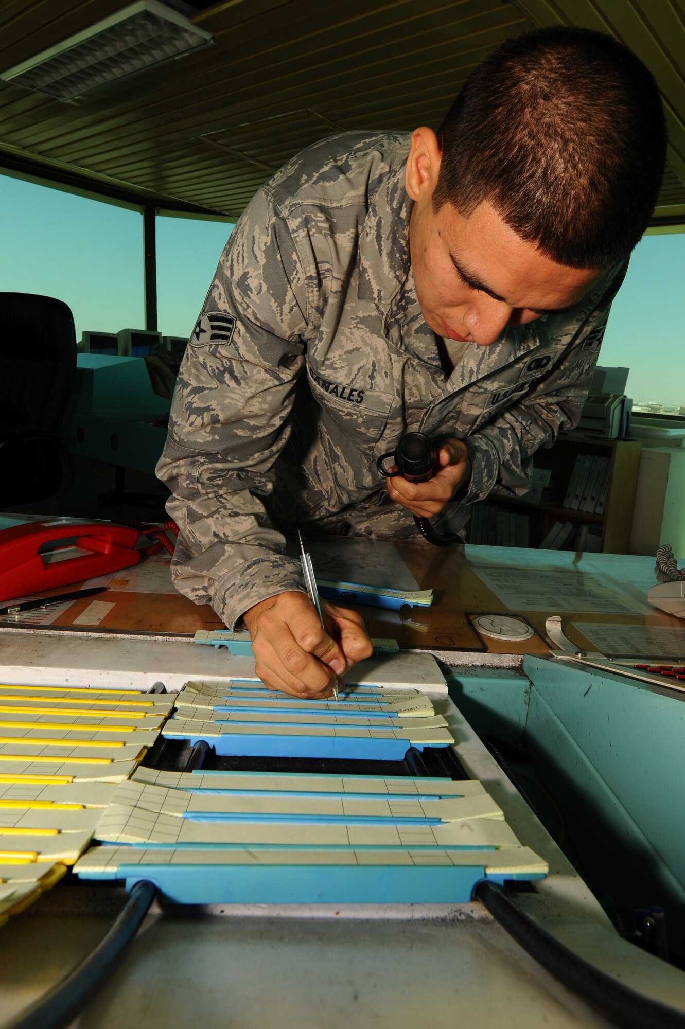 Senior Airman Salvador Canales, 379th Expeditionary Operations Support Squadron air traffic controller, updates a flight plan at a non-disclosed Southwest Asia location Feb. 9, 2010. (U.S. Air Force photo by Senior Airman Kasey Zickmund)[RELEASED]