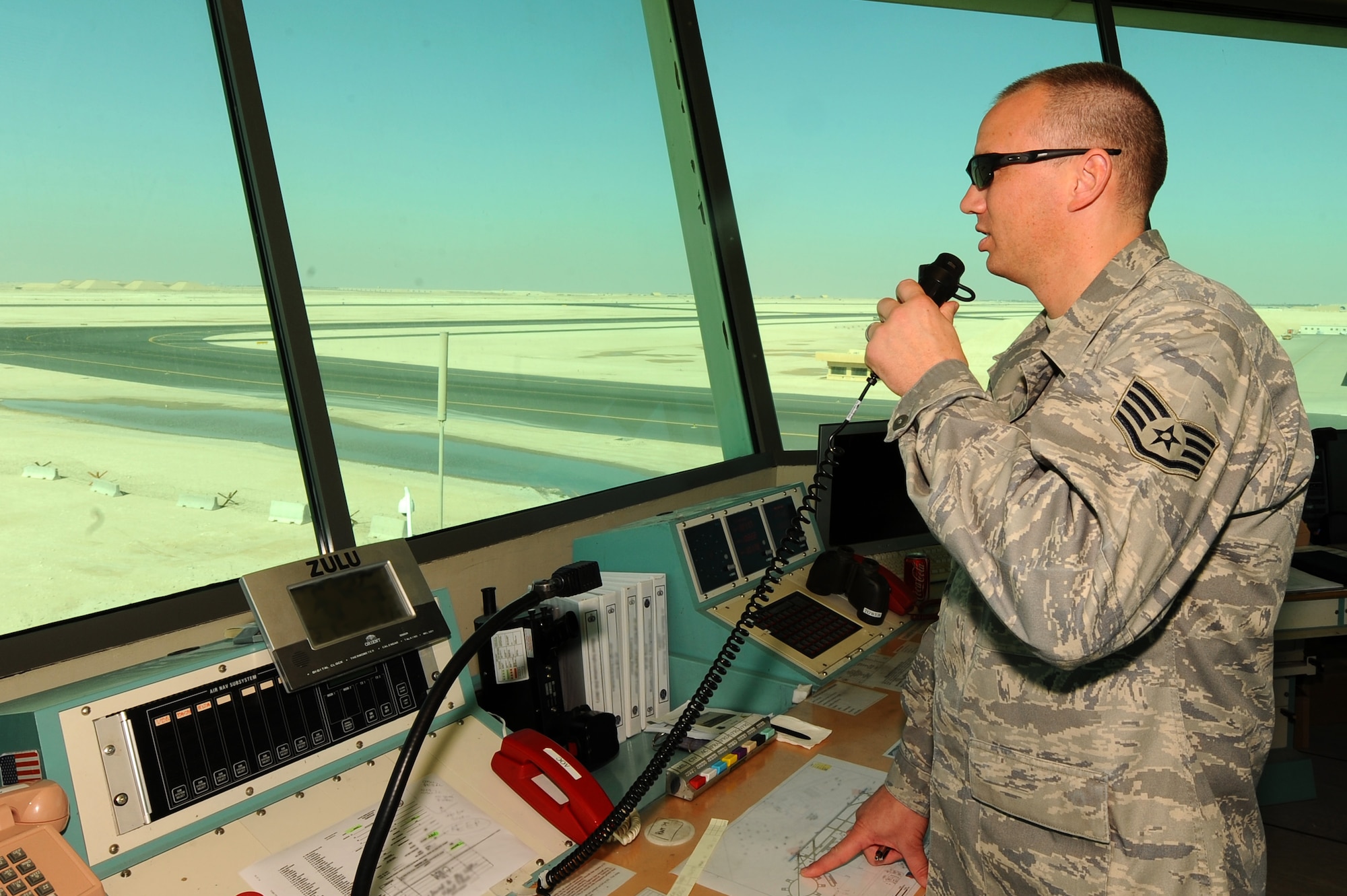 Staff Sgt. Lee Armstrong, 379th Expeditionary Operations Support Squadron air traffic controller, clears an aircraft for takeoff at a non-disclosed Southwest Asia location Feb. 9, 2010. (U.S. Air Force photo by Senior Airman Kasey Zickmund)[RELEASED]