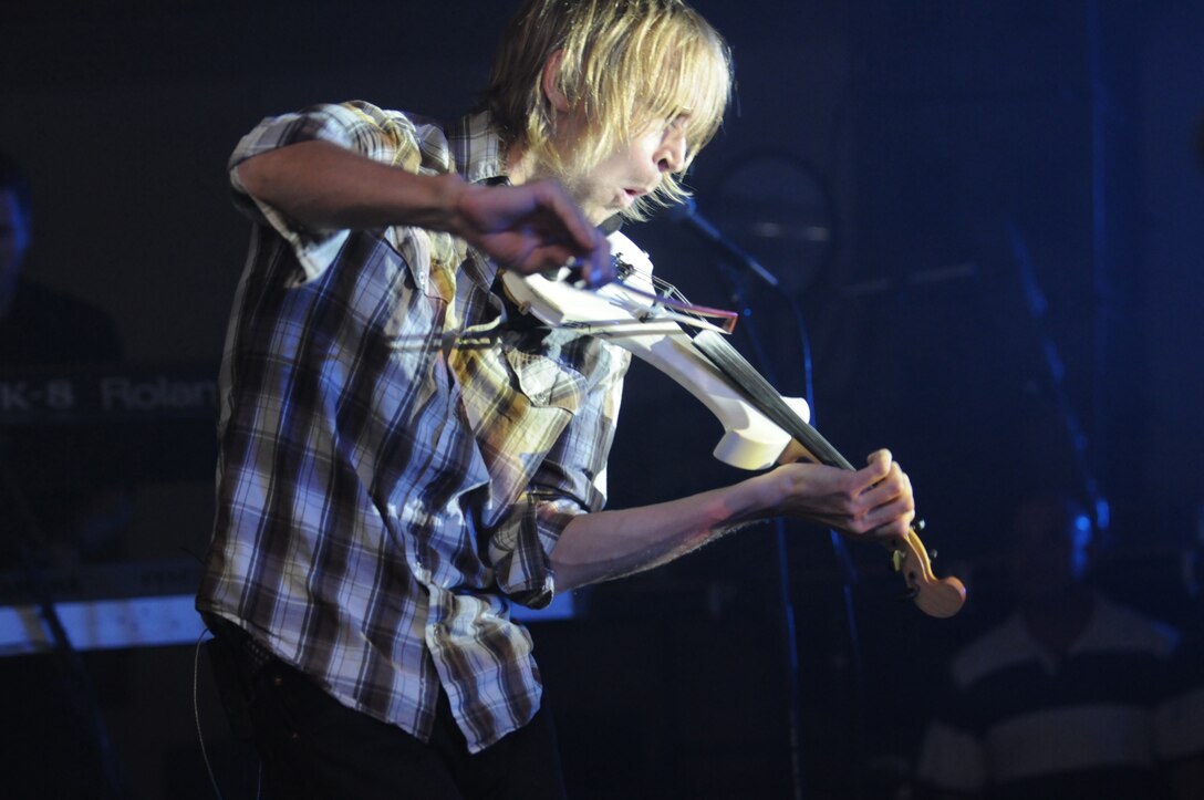 Dan Myers, electric violinist and vocalist for Gary Sinise and the Lt. Dan Band, leads a cover of The Who’s “Baba O’Riley” during the band’s performance at the Marine Corps Air Station in Yuma, Ariz., Feb. 13, 2010. Nearly 350 service members and civilians turned up to watch the band. Playing for almost two-and-a-half hours, the band provided covers of songs from different musical eras, from “(You Make Me Feel Like) A Natural Woman” to psychedelic classic "Purple Haze." Depending on the mood the band set, people were either dancing wildly on stage or slowly stepping face-to-face with their loved one. “I loved it,” said Heather Bunn, local nurse.