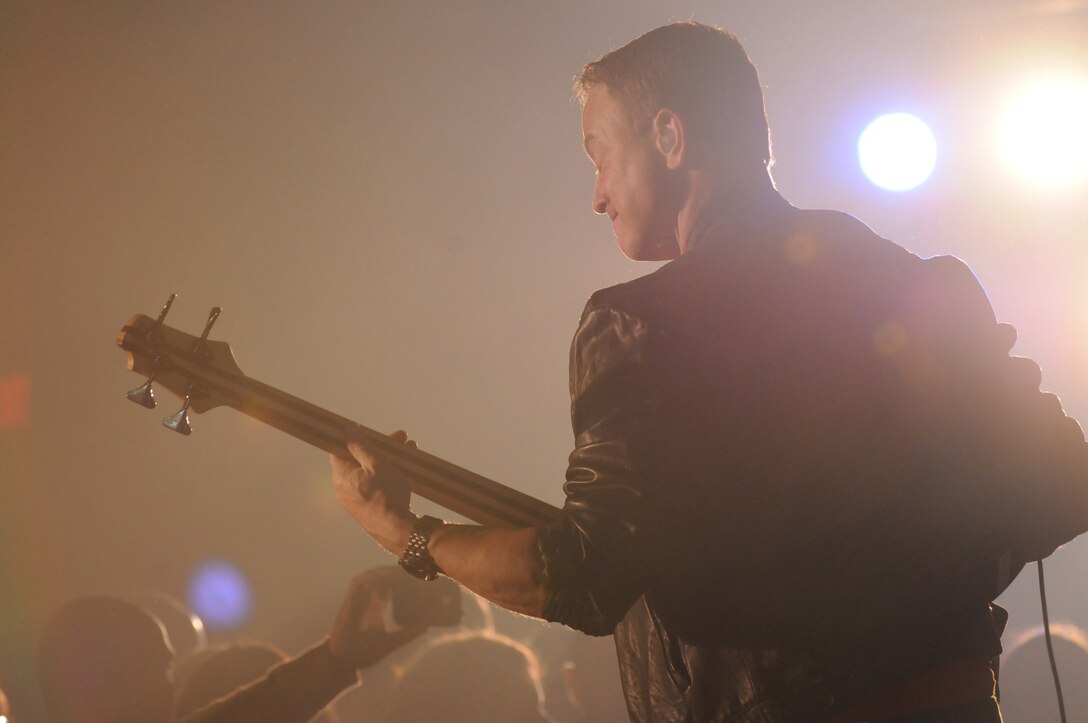 Gary Sinise, award-winning actor and bass guitarist for the Lt. Dan Band, plays in front a crowd at the Marine Corps Air Station in Yuma, Ariz., Feb. 13, 2010. The band’s performance in front of nearly 350 service members and civilians marked the first time they played at the air station. The event was hosted by TriWest and sponsored by the USO. Nearly 350 service members and civilians turned up to watch the band. Playing for almost two-and-a-half hours, the band provided covers of songs from different musical eras, from “(You Make Me Feel Like) A Natural Woman” to psychedelic classic "Purple Haze."